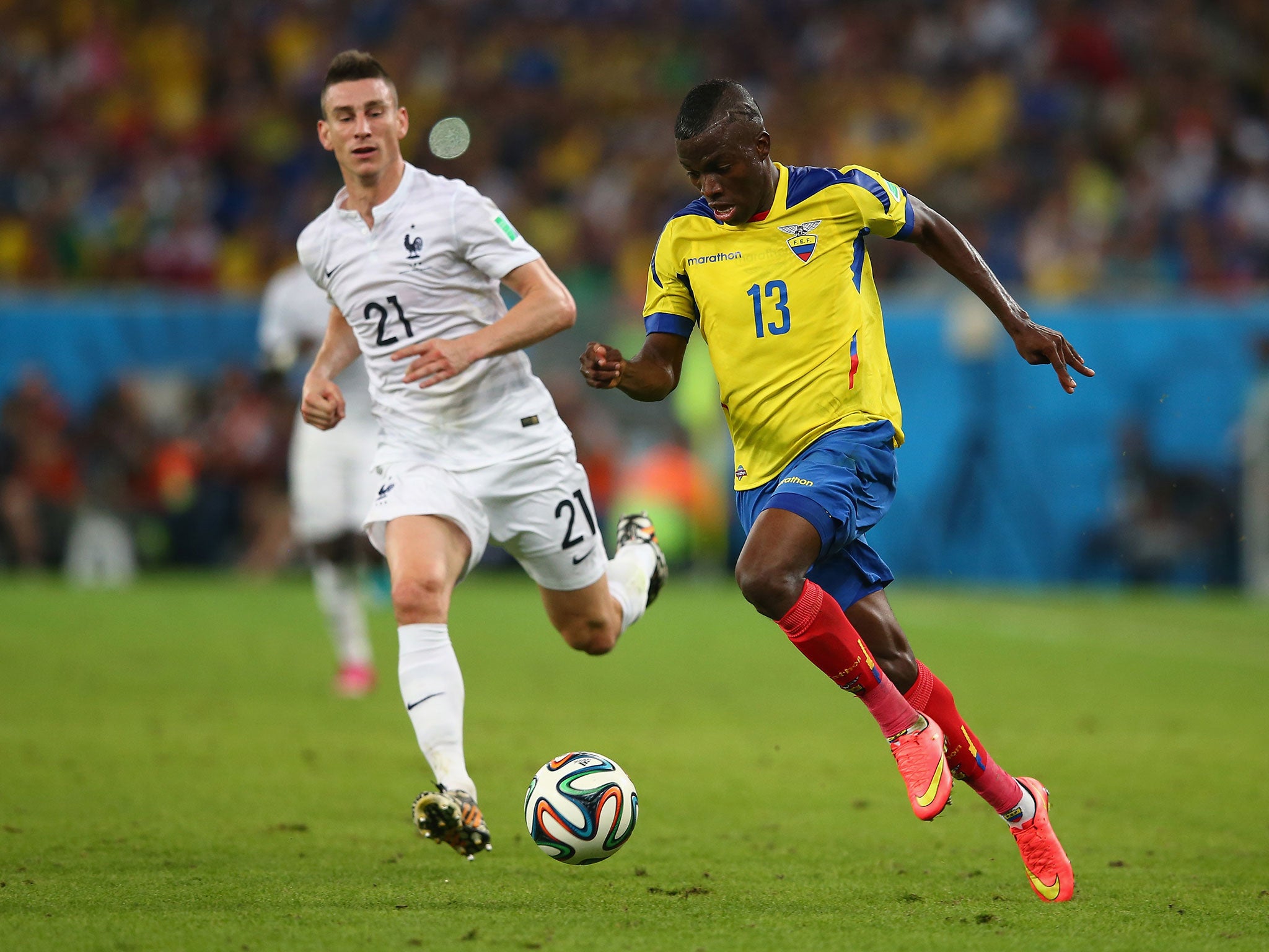 Enner Valencia of Ecuador controls the ball against Laurent Koscielny of France during the 2014 FIFA World Cup Brazil Group E match between Ecuador and France