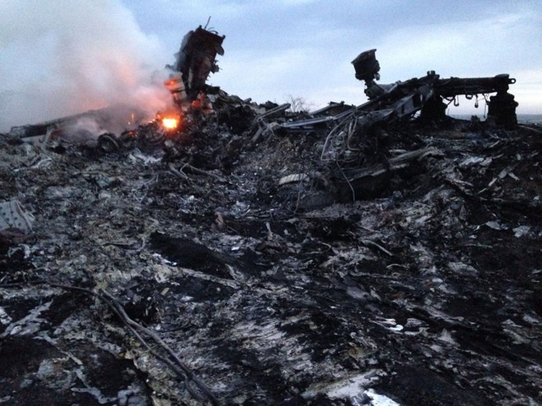 Smoke rises up at a crash site near the village of Grabovo