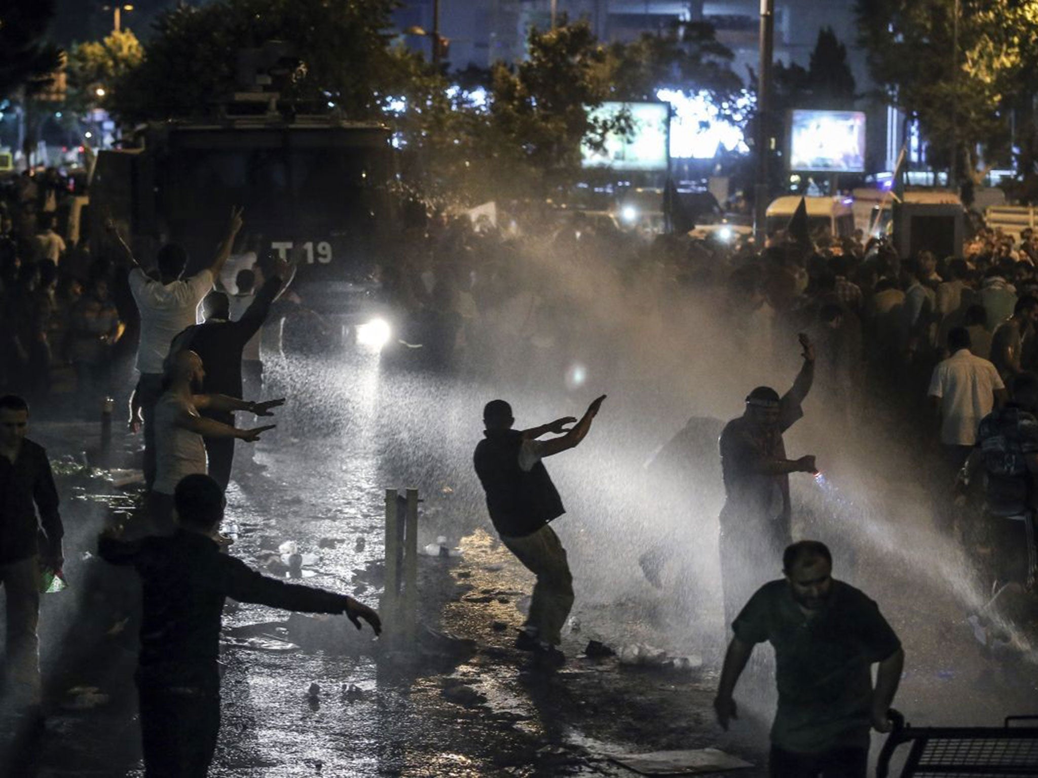 Riot police uses water cannons and teargas to stop hundreds of pro-Palestinian Turks, staging a protest rally outside the Israeli consulate in Istanbul