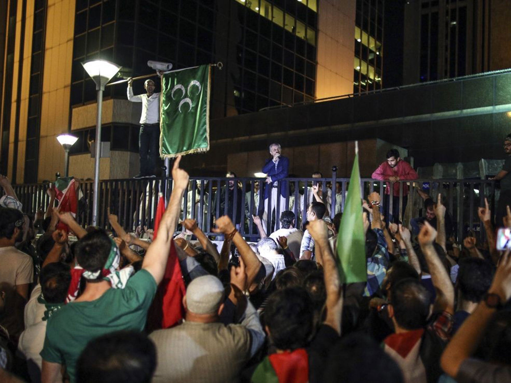 Turkish protesters demonstrate outside the Israeli consulate in Istanbul after Israel launched a ground operation in Gaza Strip