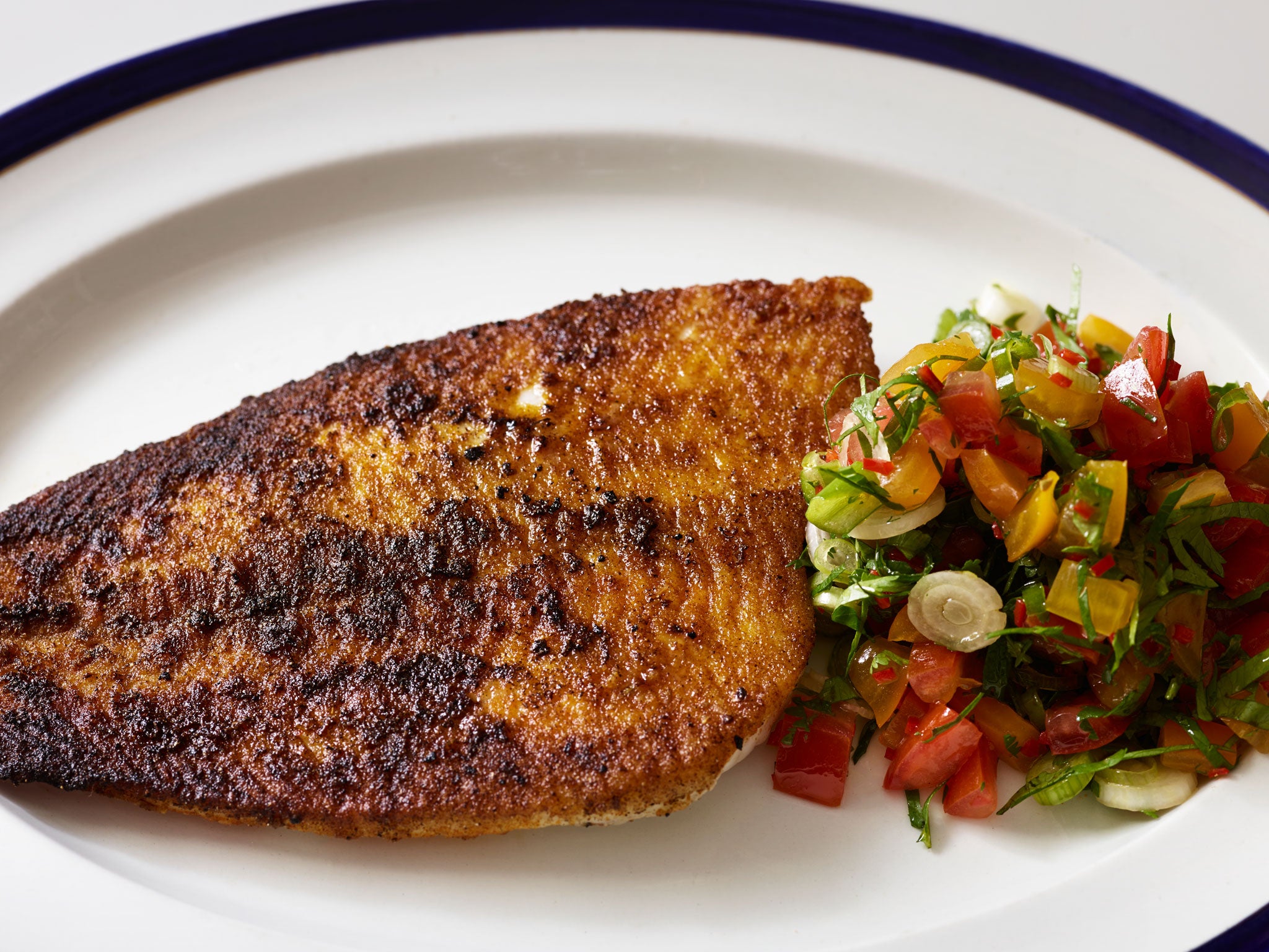 Blackened plaice with tomato and coriander salsa