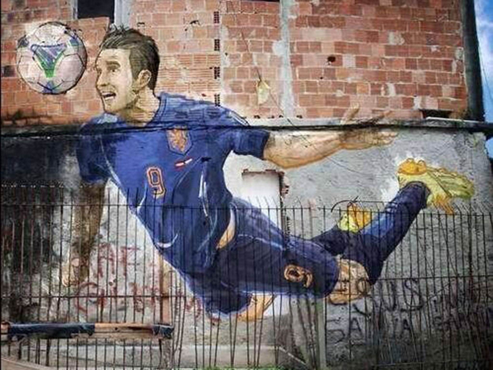 Robin van Persie's brilliant header has been transformed into a piece of street art in a Brazilian favela