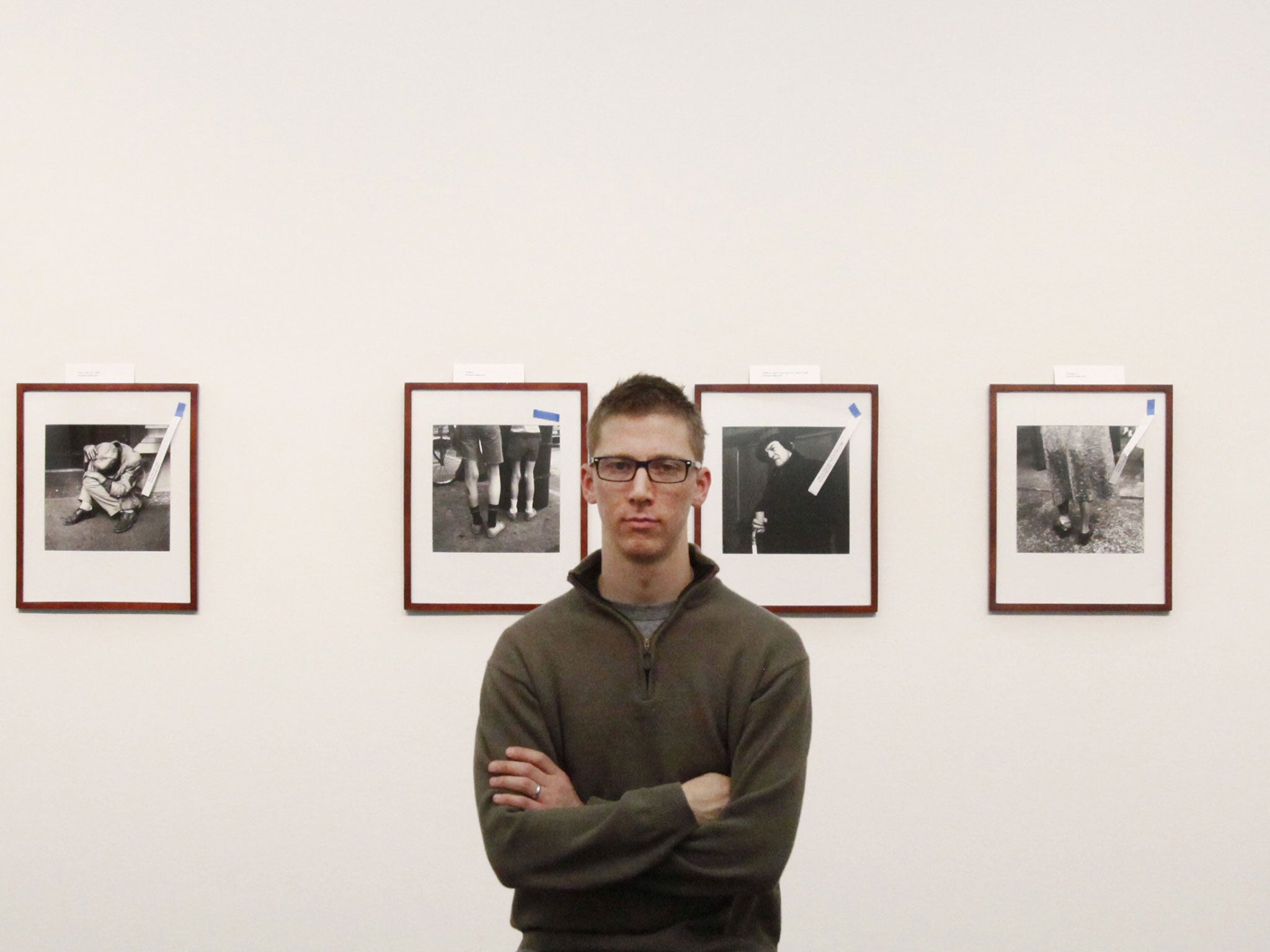 Collector John Maloof in front of her photographs at the Cultural Center in Chicago