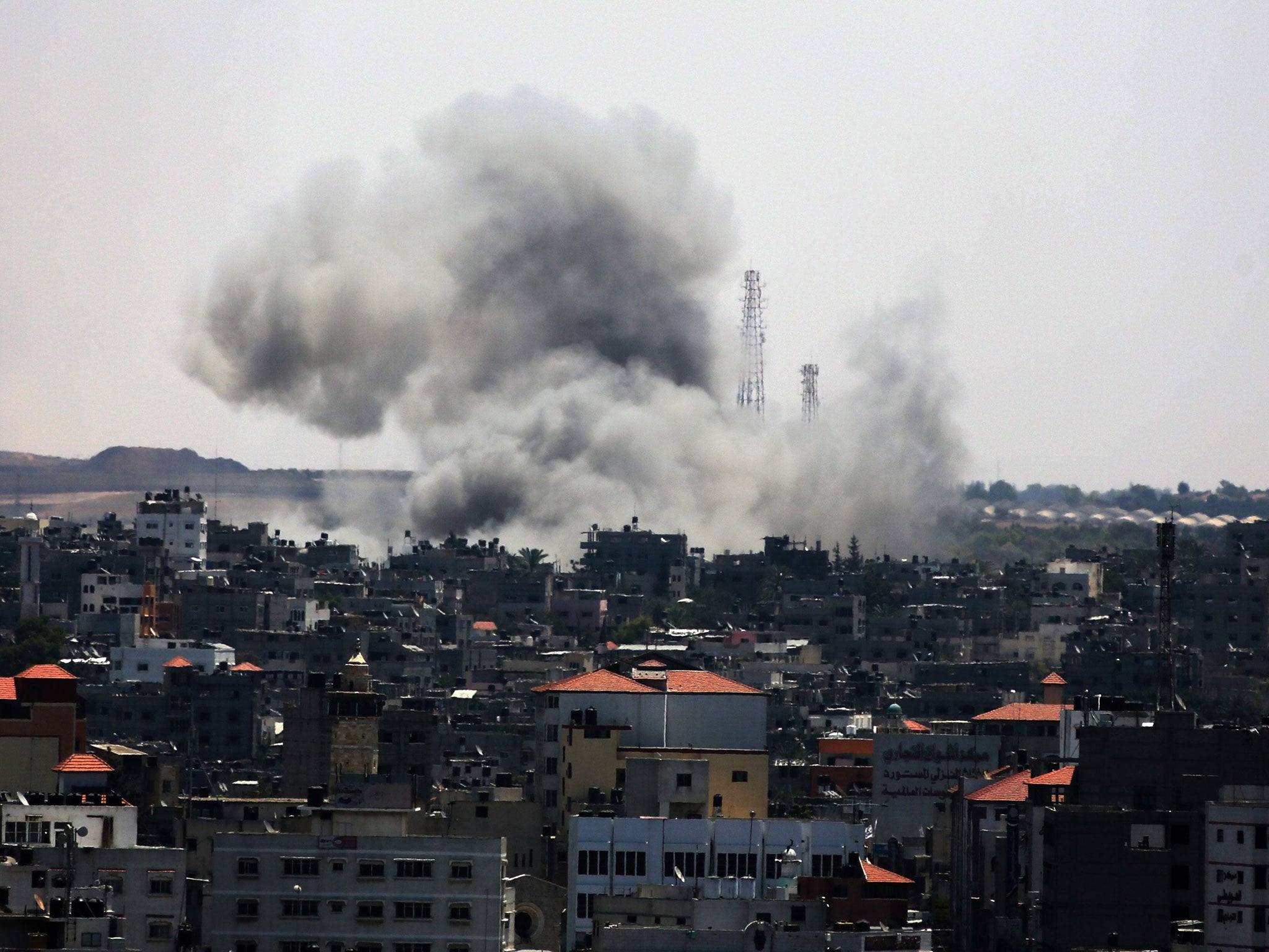 Smoke rises after an attack by Israeli aircraft in the east of Gaza City yesterday