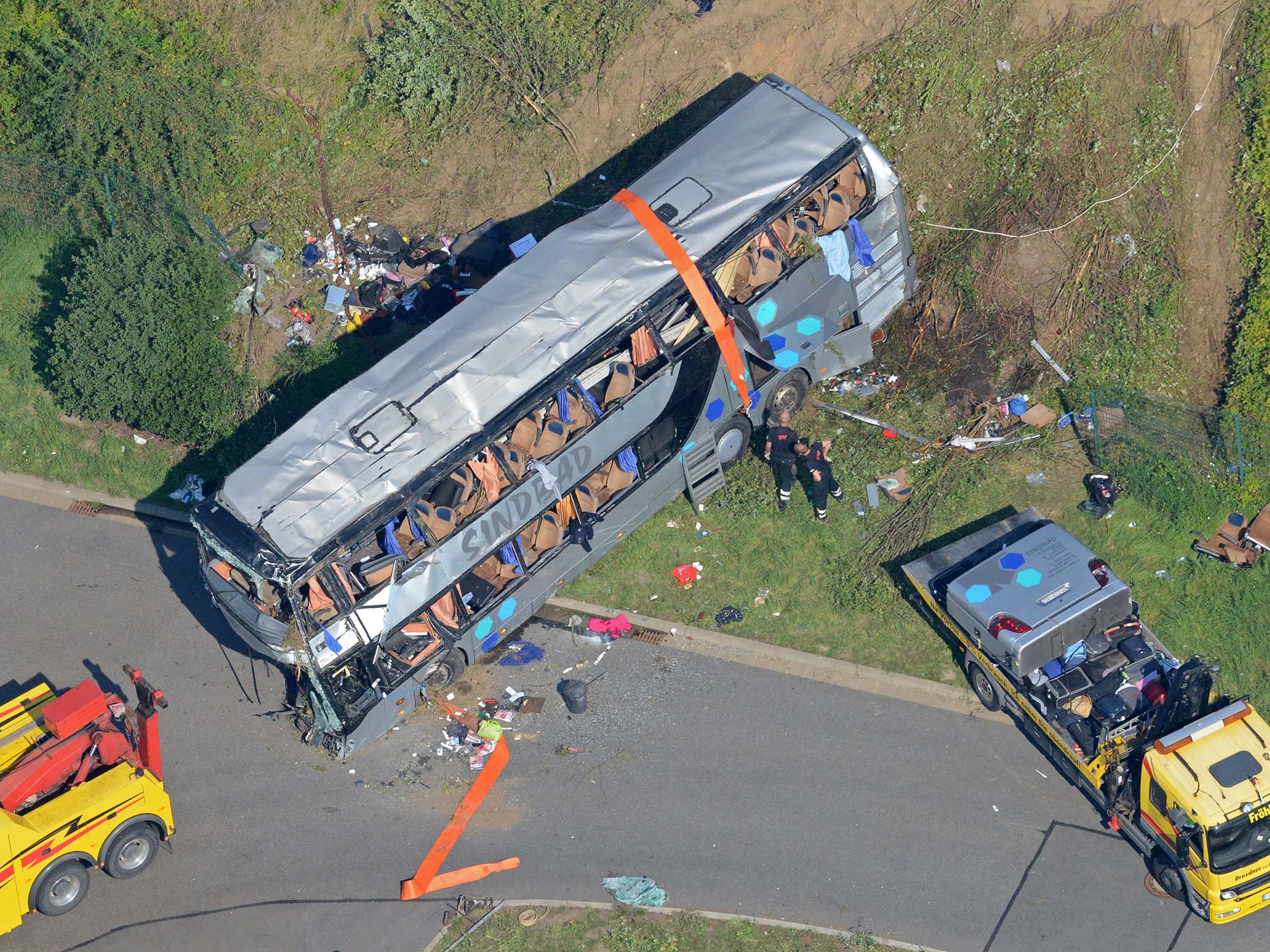 Aerial view shows the accident site of a bus crash on the A4 motorway linking Poland and Germany near the Neustadt district in Dresden, eastern Germany, on July 19, 2014. At least nine people were killed and dozens hurt, police said, as a coach carrying P