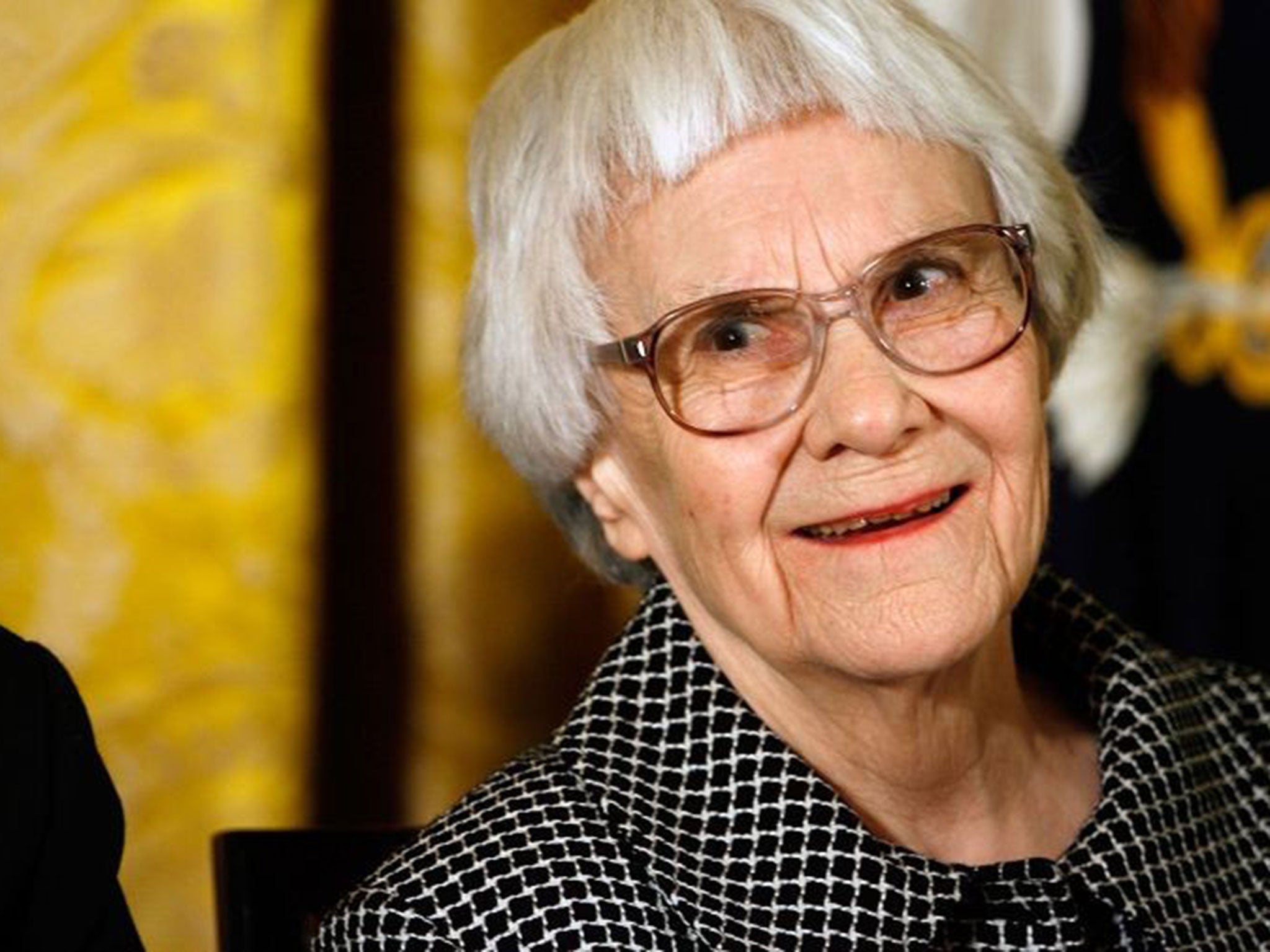 Harper Lee smiles before receiving the 2007 Presidential Medal of Freedom