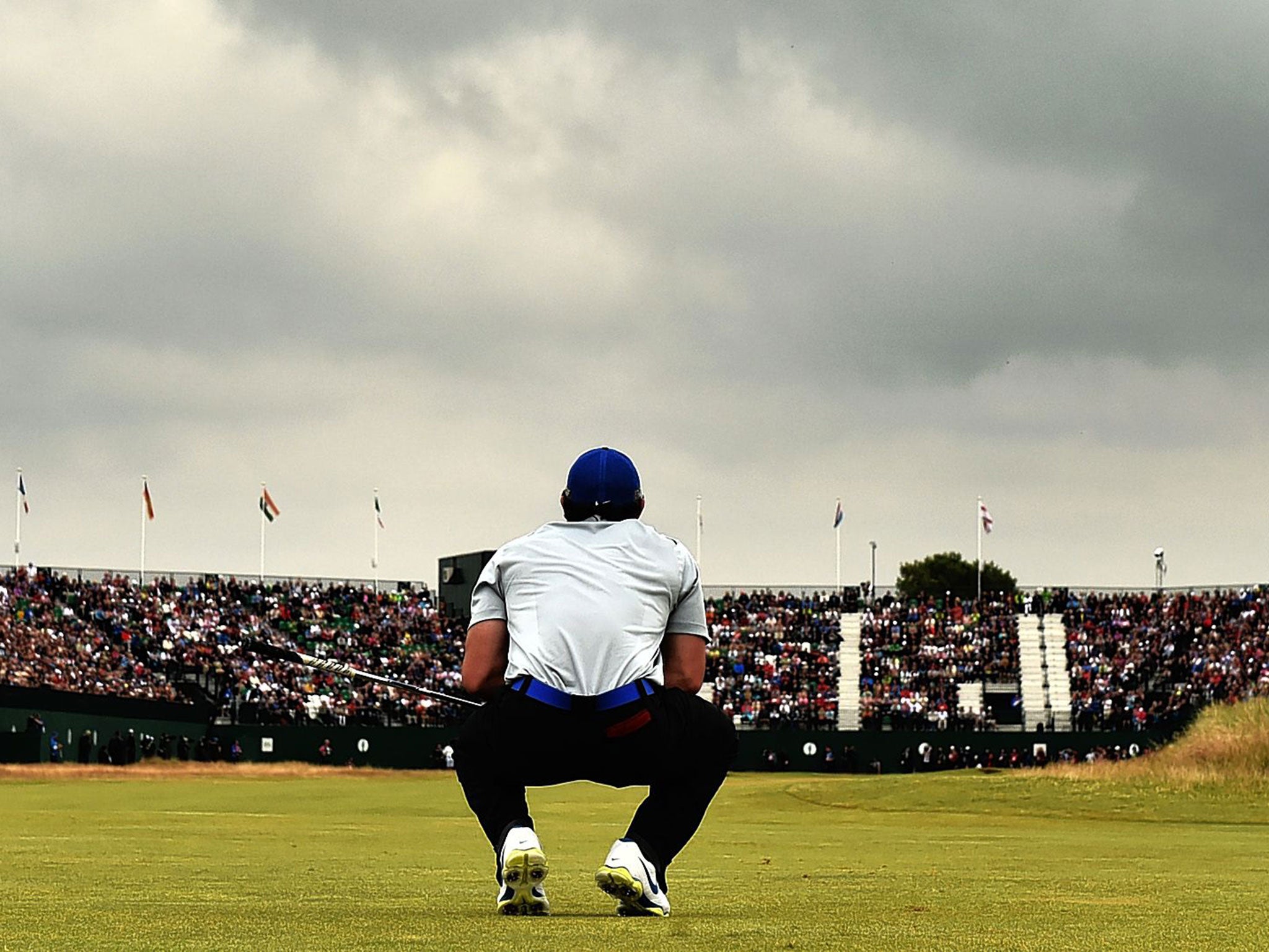 Rory McIlroy delights the packed stands with a scintillating second shot at the 18th