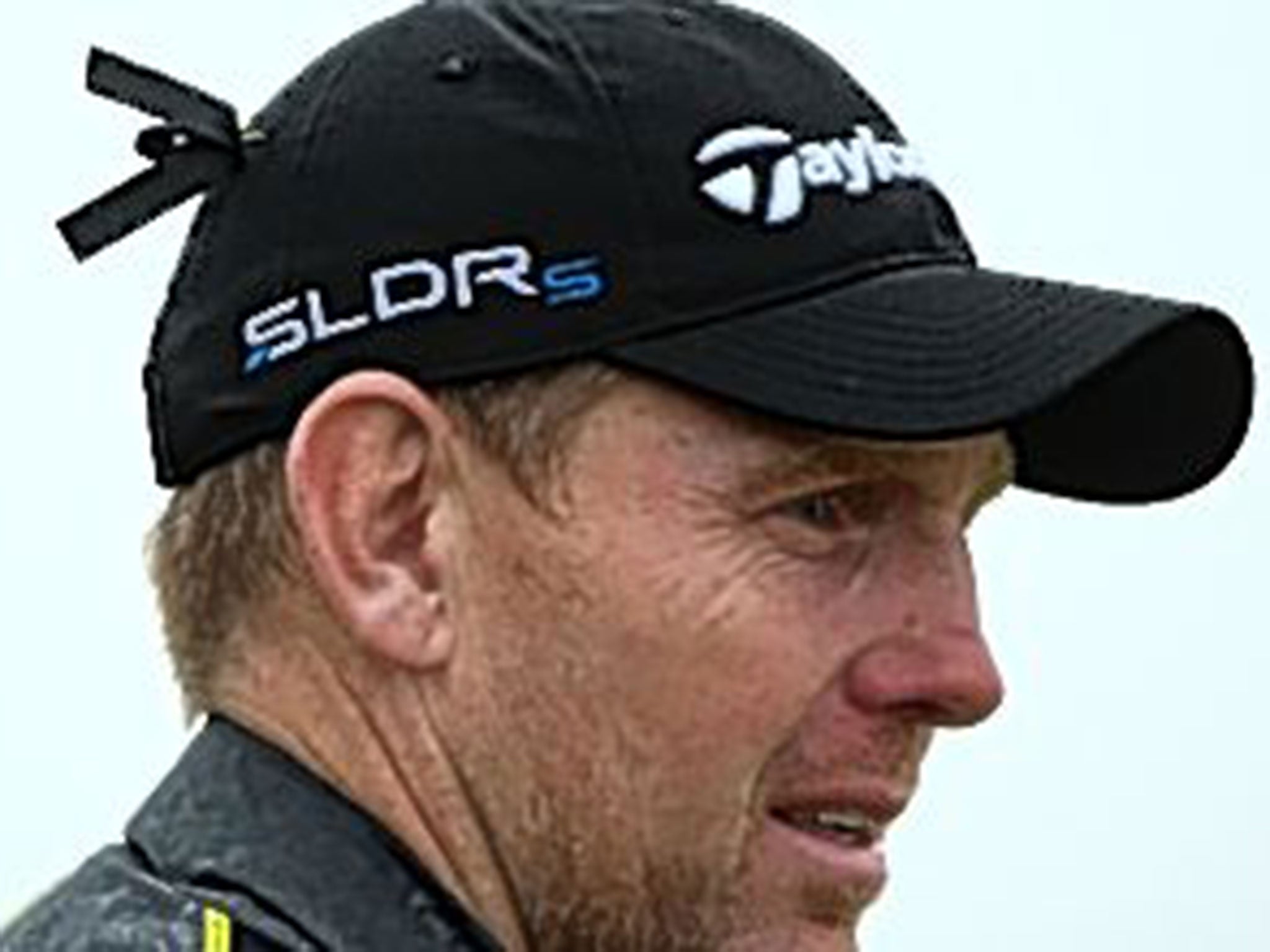 Shane Lowry, Matteo Manassero and Stephen Gallacher wear black ribbons to honour the late Bob Torrance