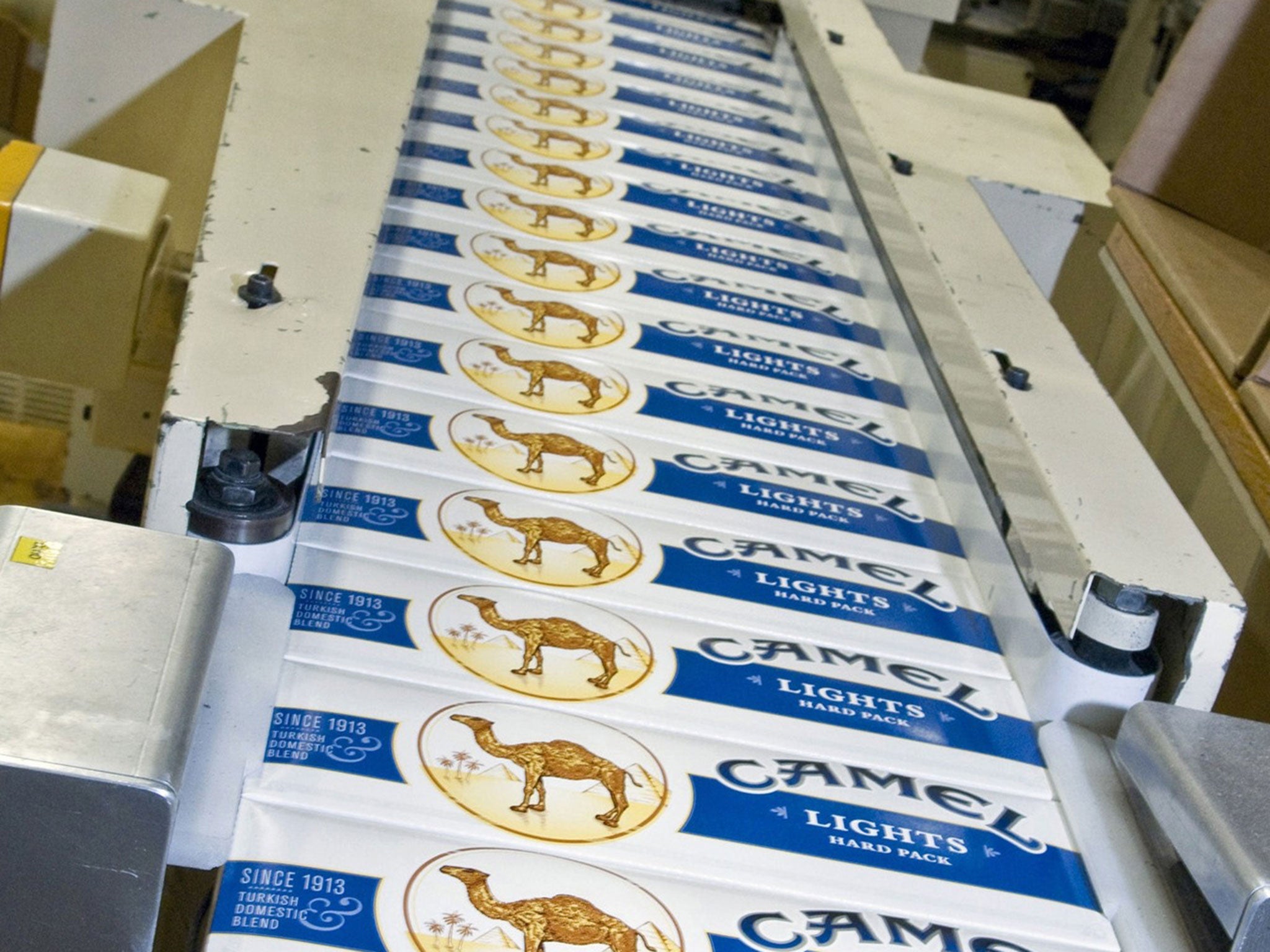 Cartons of Camel cigarettes come off the assembly line at an R.J. Reynolds plant