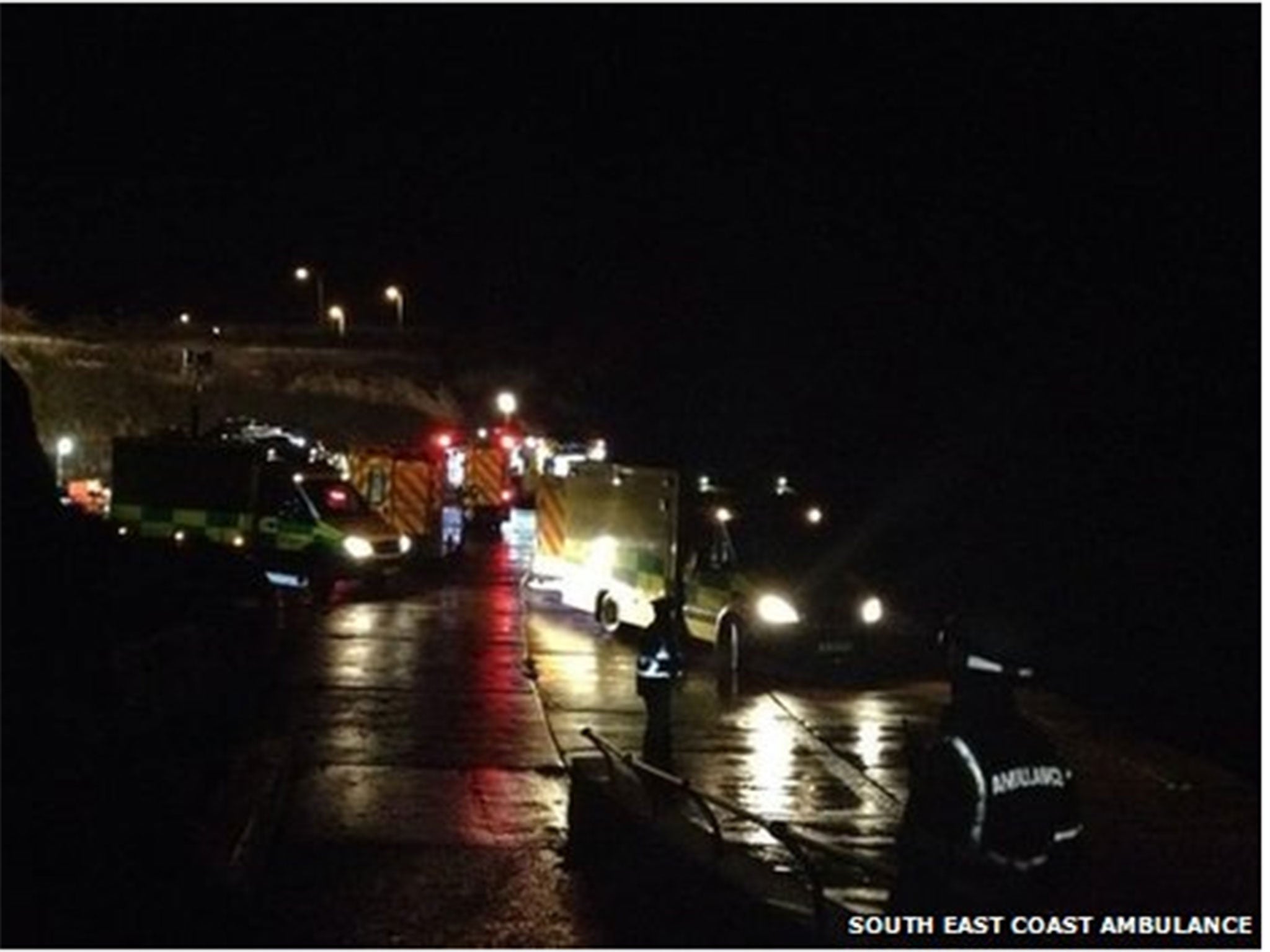 The car that dived off a cliff with five people inside it landed on its roof. Three women had to be cut free from the car.