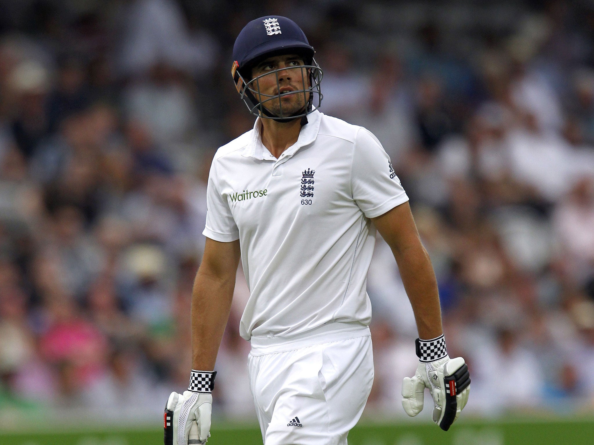 England's Captain Alastair Cook walks back to the pavilion after getting out for 22 runs