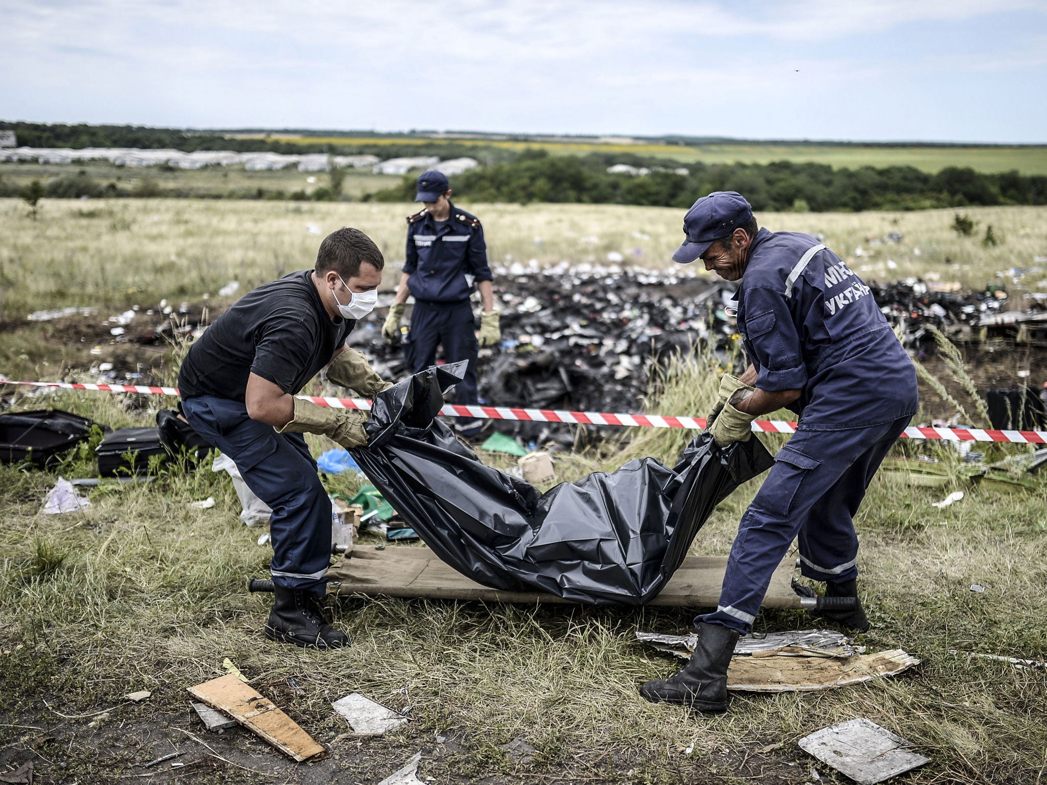 Bodies are removed from the site