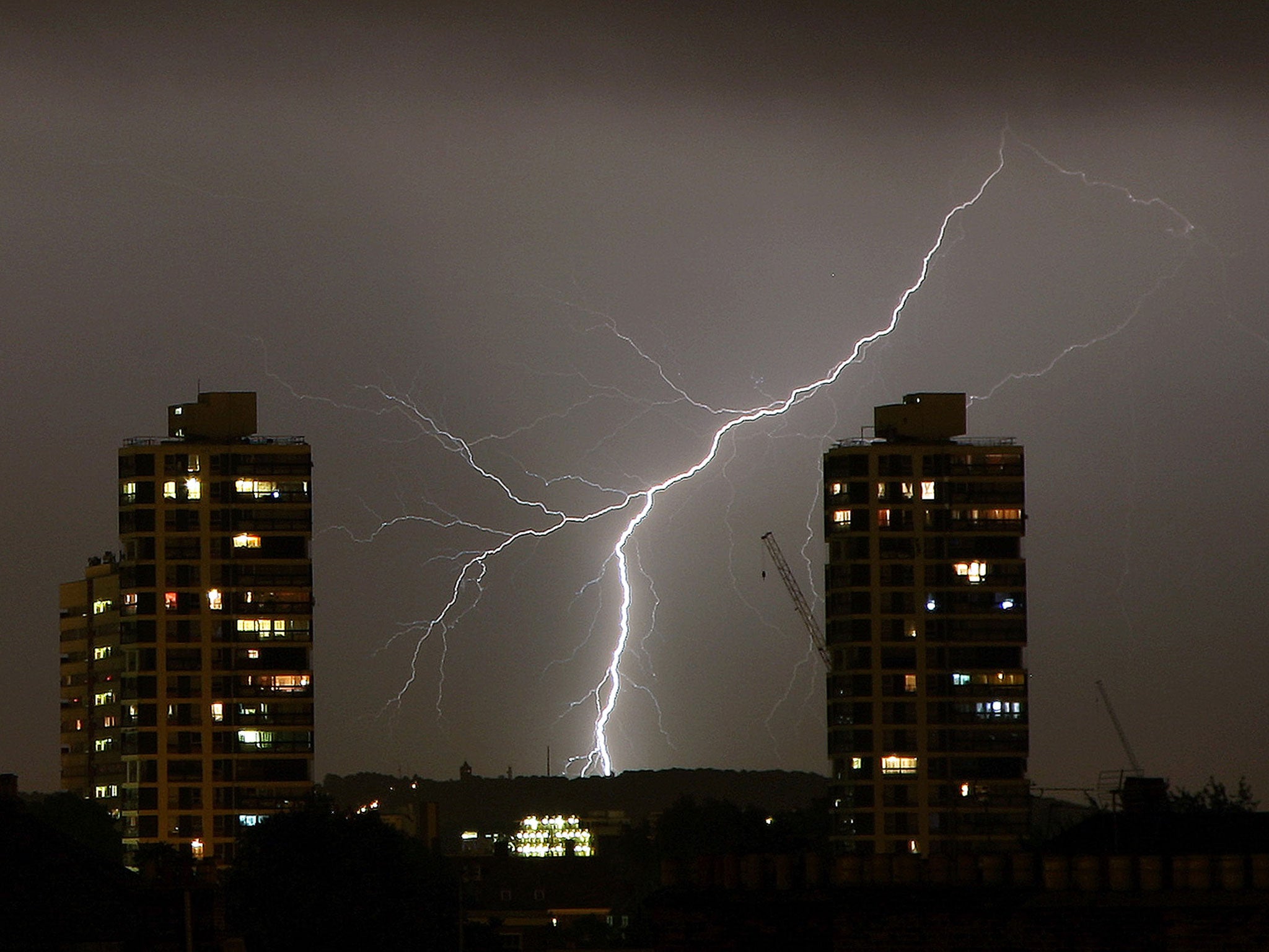 Lightning flashes in the night sky over South London