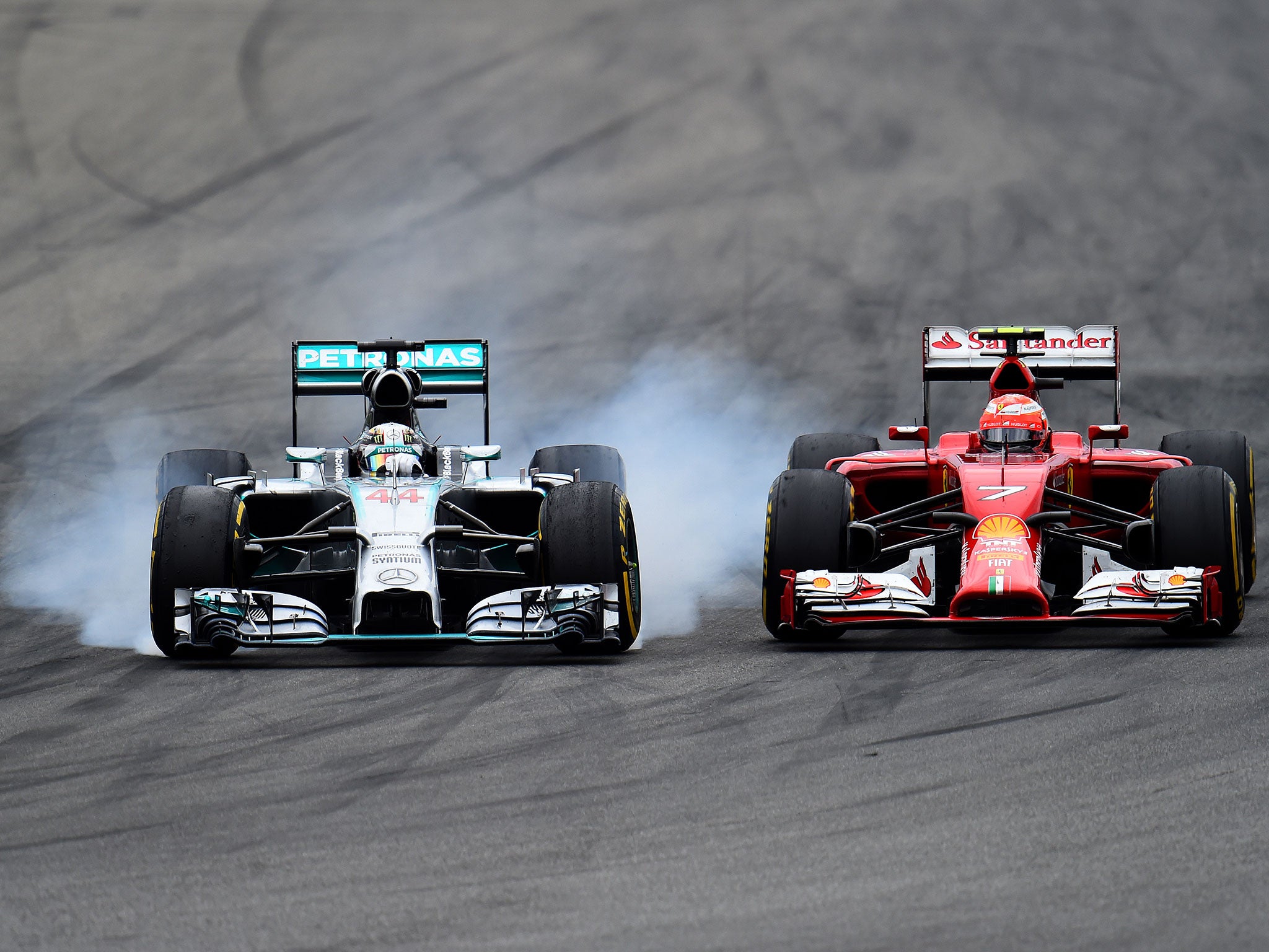 Lewis Hamilton locks up as he overtakes Kimi Raikkonen