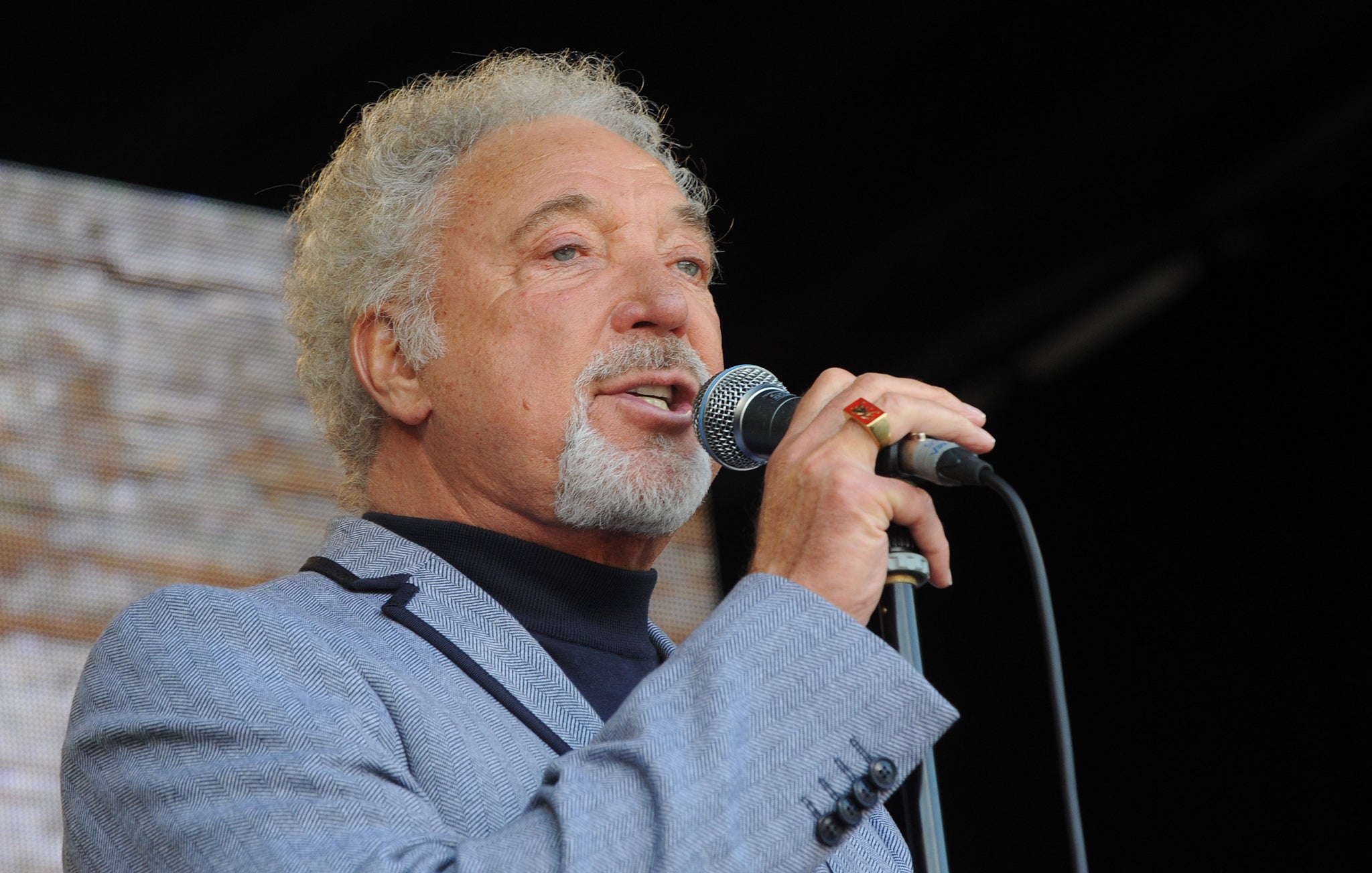 Tom Jones performs on stage