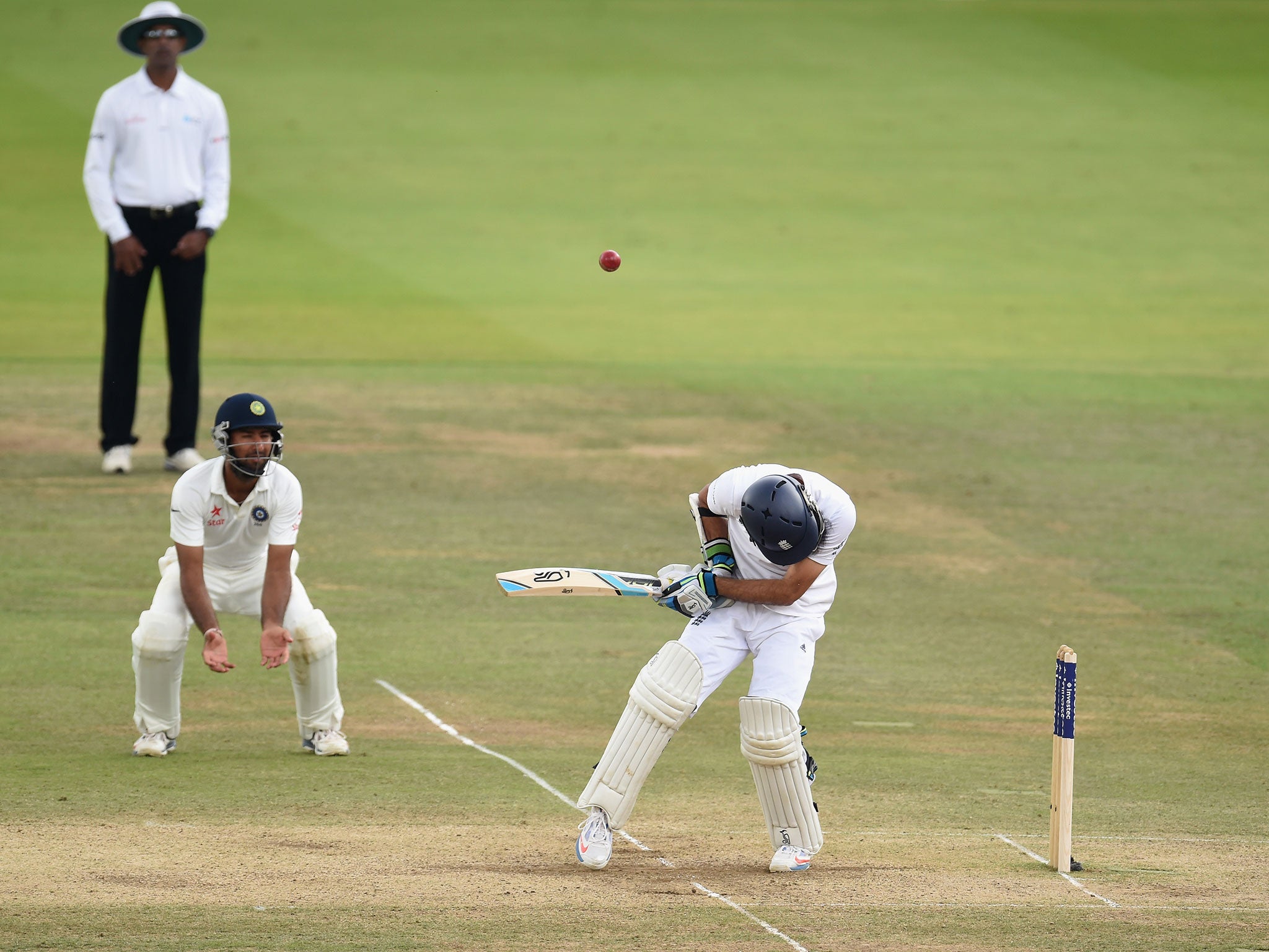 Moeen Ali plays the final ball before lunch into the hands of India's Cheteshwar Pujara