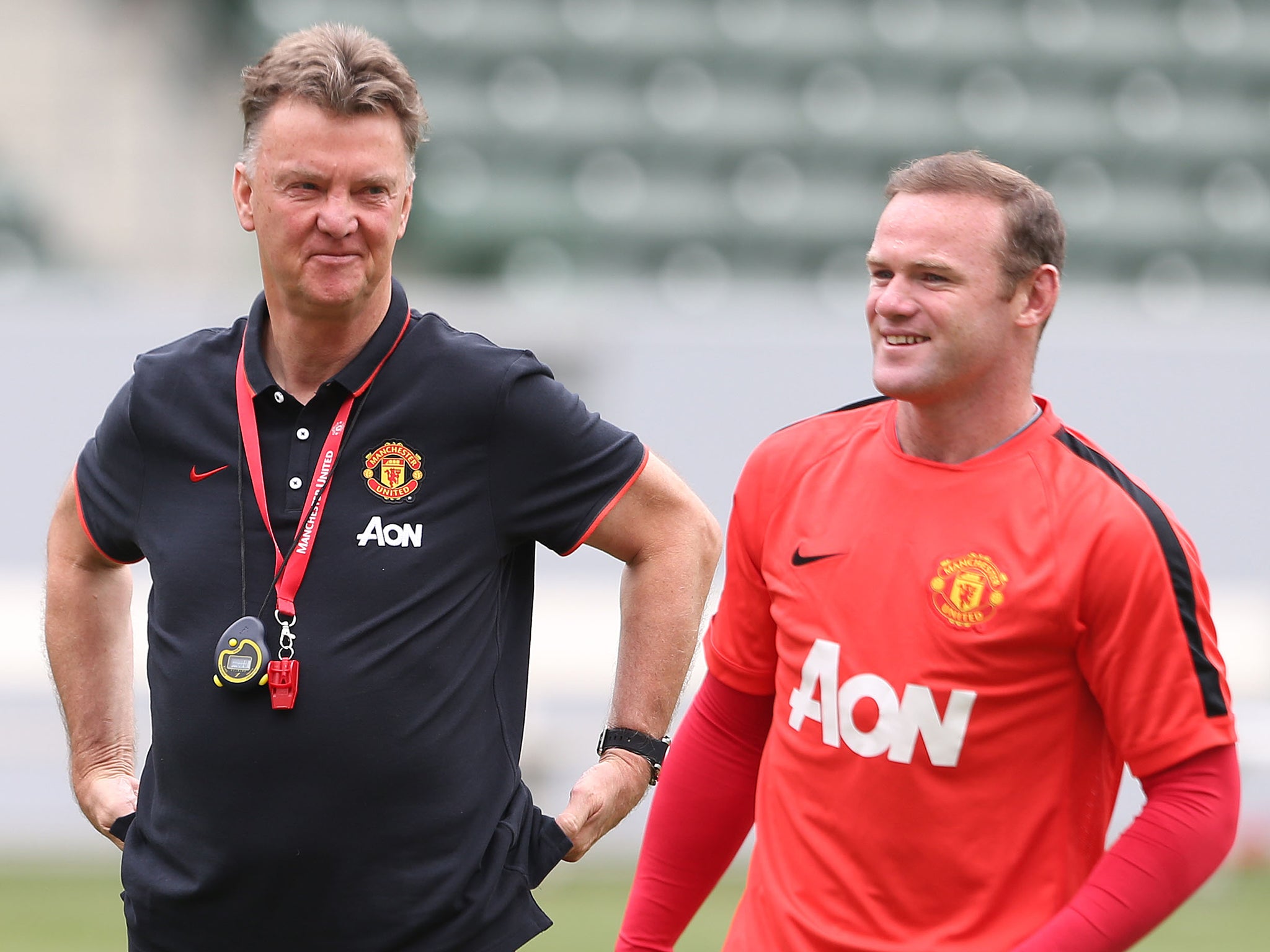 Louis van Gaal works with Wayne Rooney during pre-season