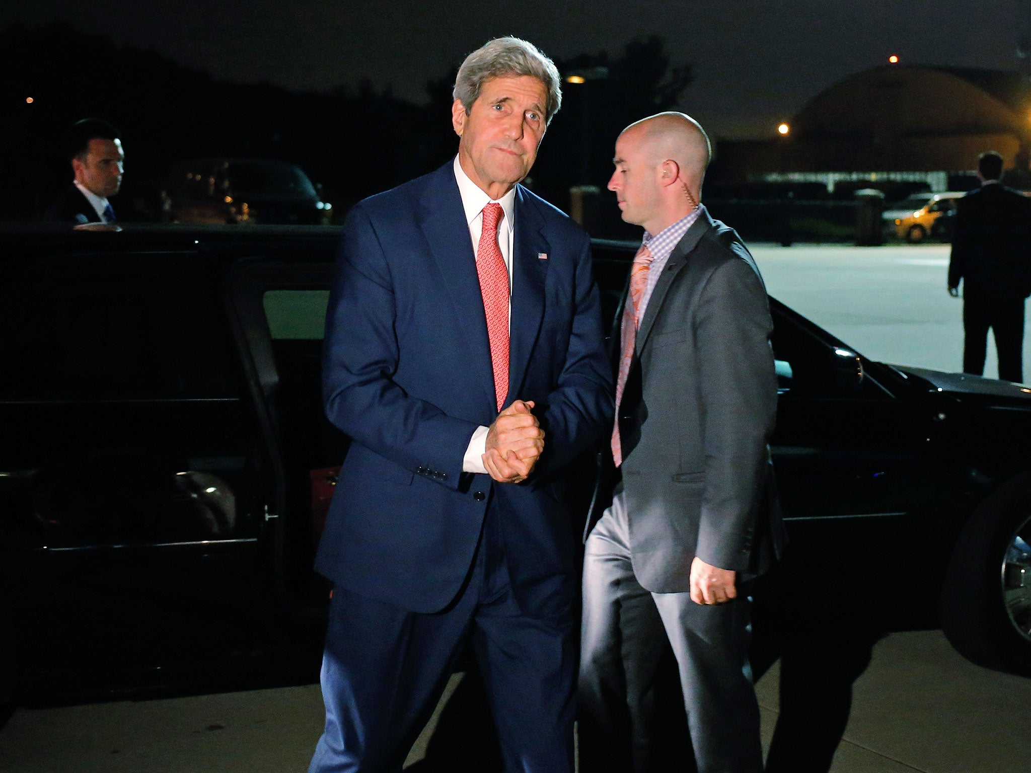 Secretary of State John Kerry steps out of his vehicle to board his plane at Andrews Air Force Base as he begins his trip to the Middle East