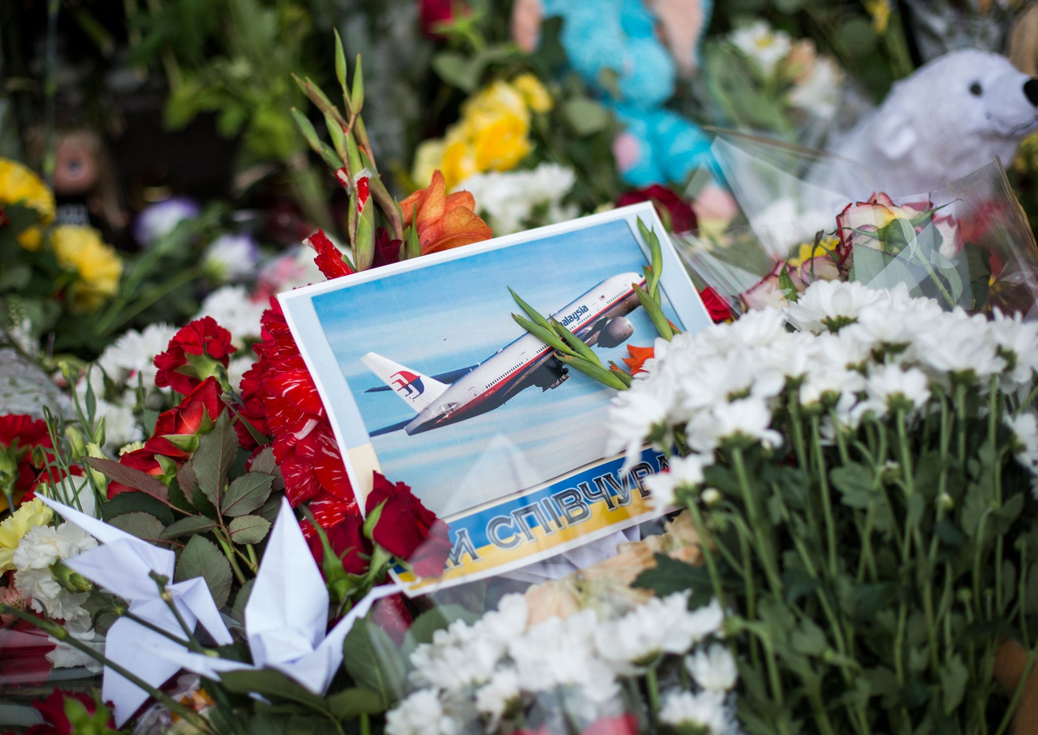 lowers, candles and other tributes in front of the Netherlands Embassy in memory of the victims of Malaysia Airlines flight MH17