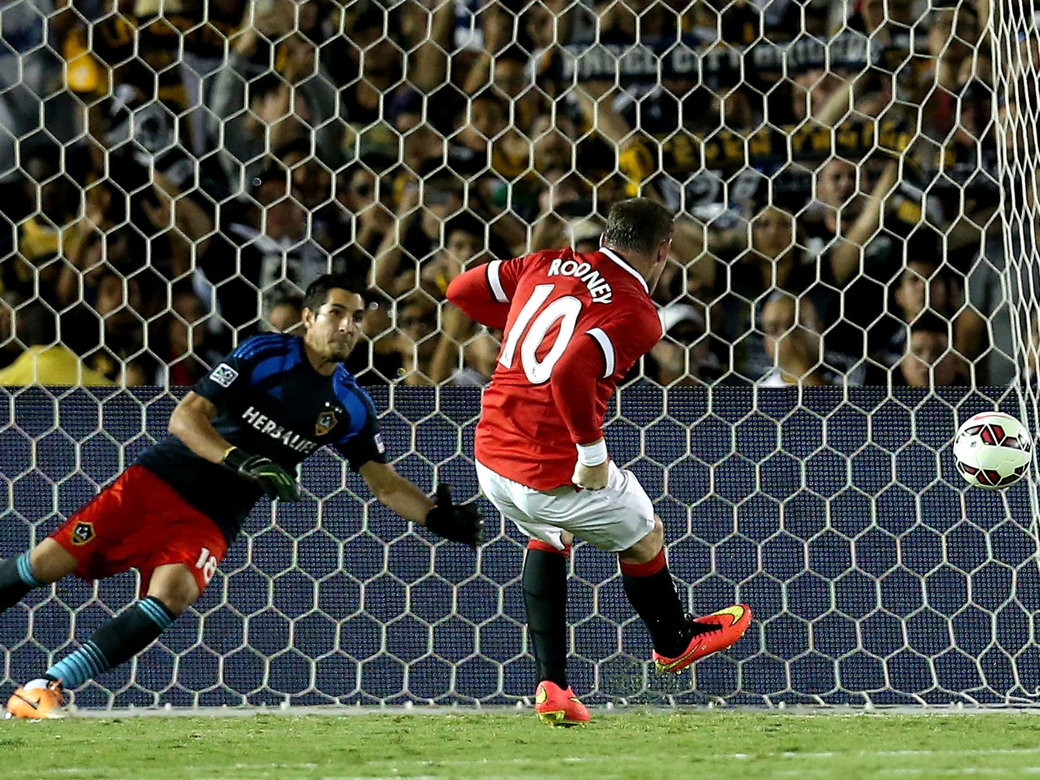 Wayne Rooney scores a penalty during the 7-0 victory over LA Galaxy