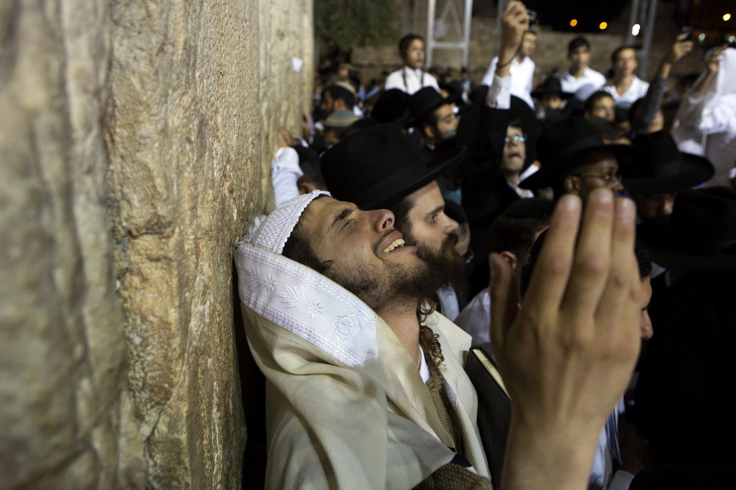 A Jewish worshipper takes part in a special prayer at the Western Wall in Jerusalem's Old City for the well-being of Israeli soldiers in Gaza