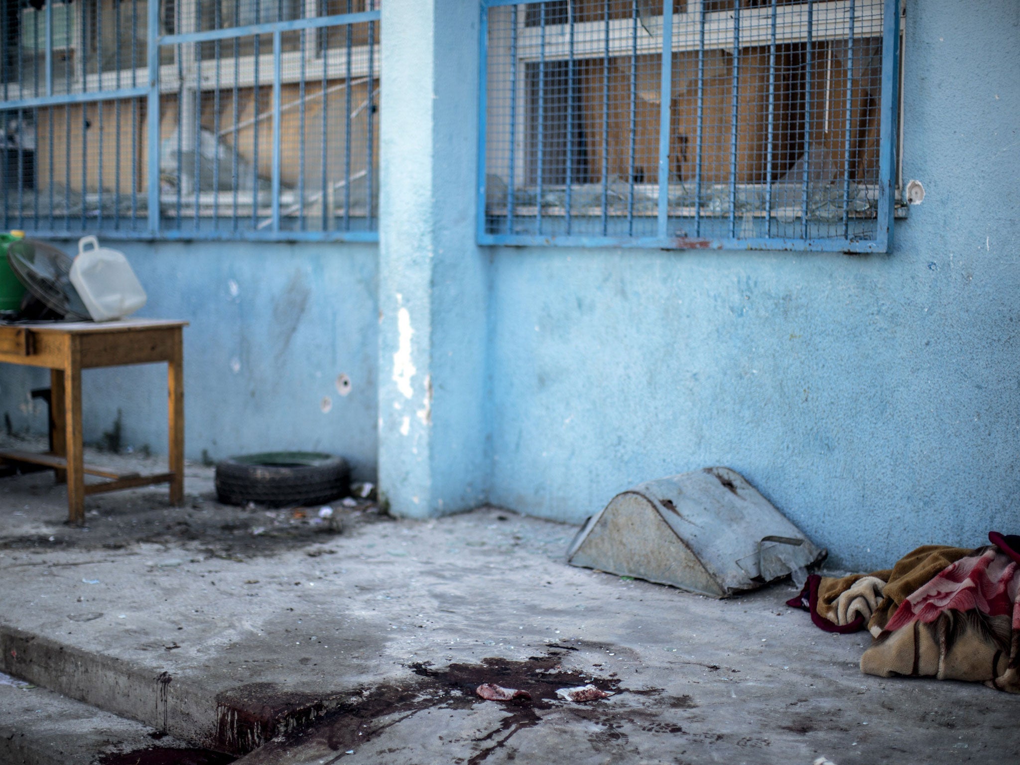 A trail of blood is seen in the courtyard of a UN School in the northern Beit Hanun district of the Gaza Strip on July 24, 2014, after it was hit by an Israeli tank shell (AFP)