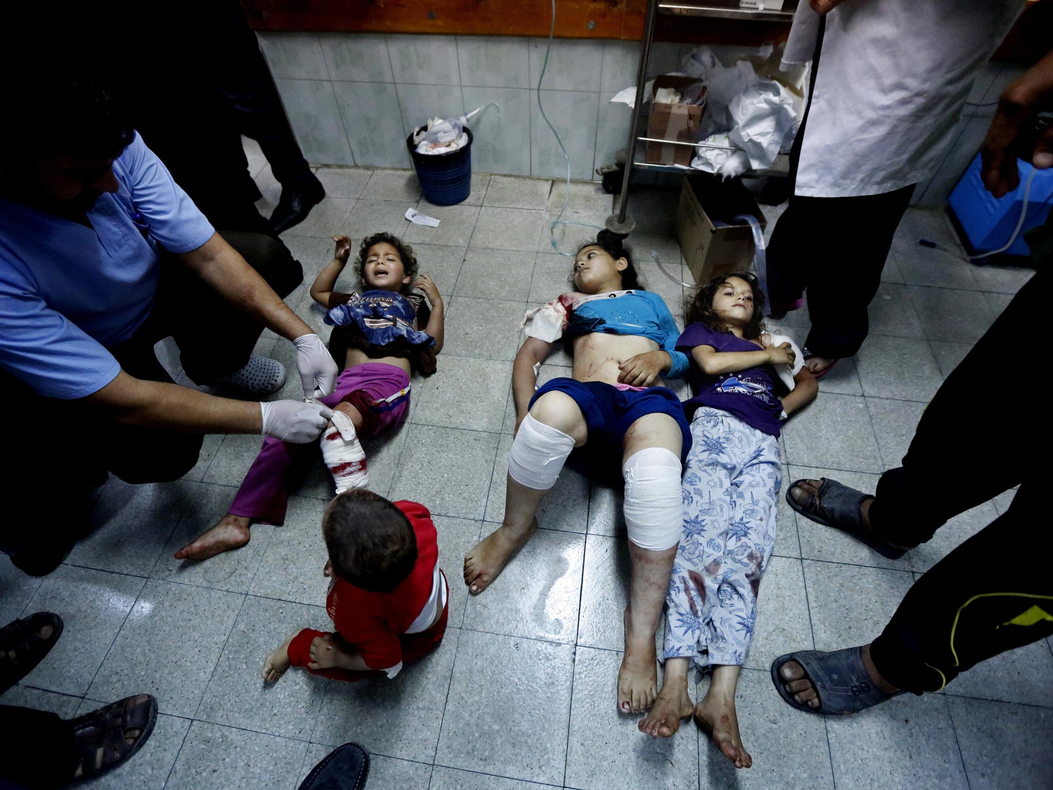 Palestinian children are treated in the Kamal Adwan hospital yesterday after being injured in an Israeli strike on a UN school in Beit Hanoun (AP)