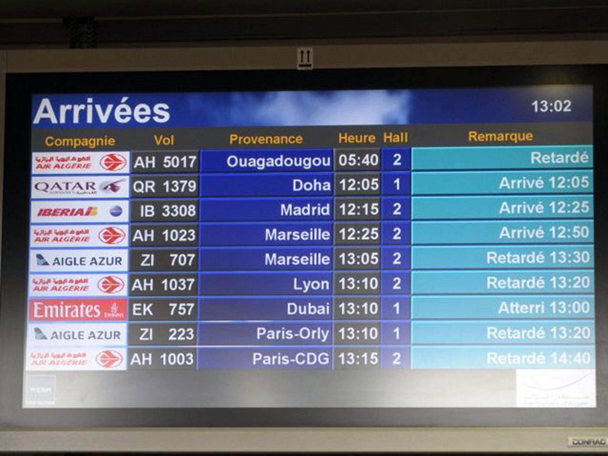 An arrival information screen shows the delayed Air Algerie flight 5017 (top) at the Houari Boumediene airport near Algiers (AP)