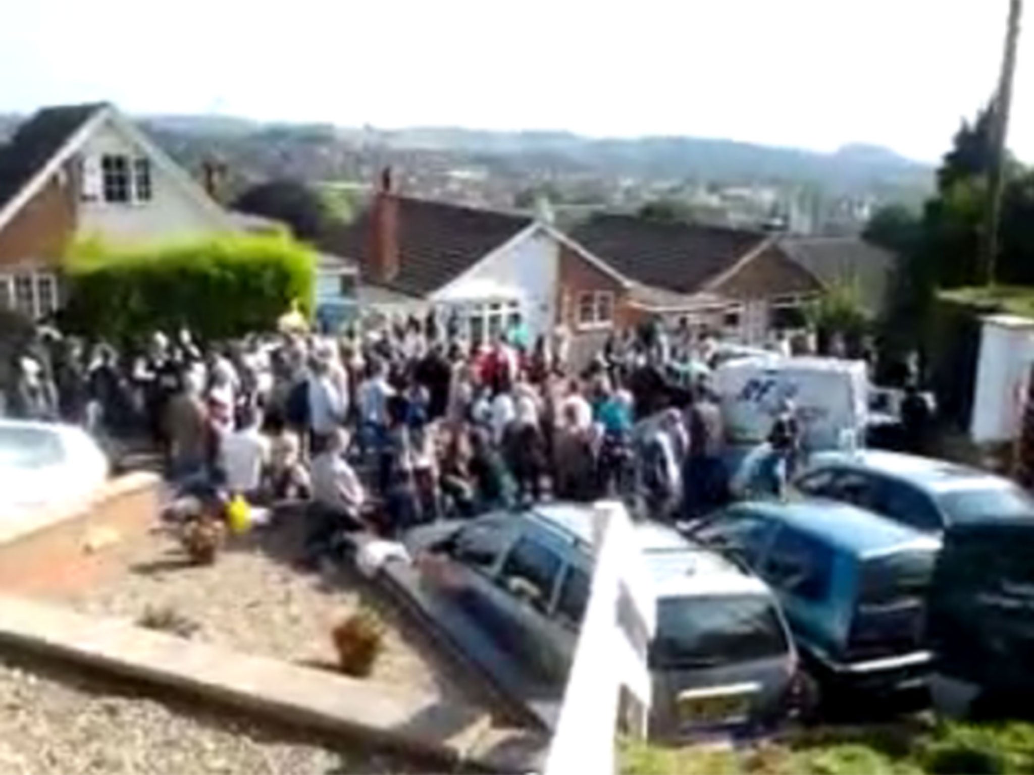 Hundreds gathered to form human barrier in front of Crawford's house