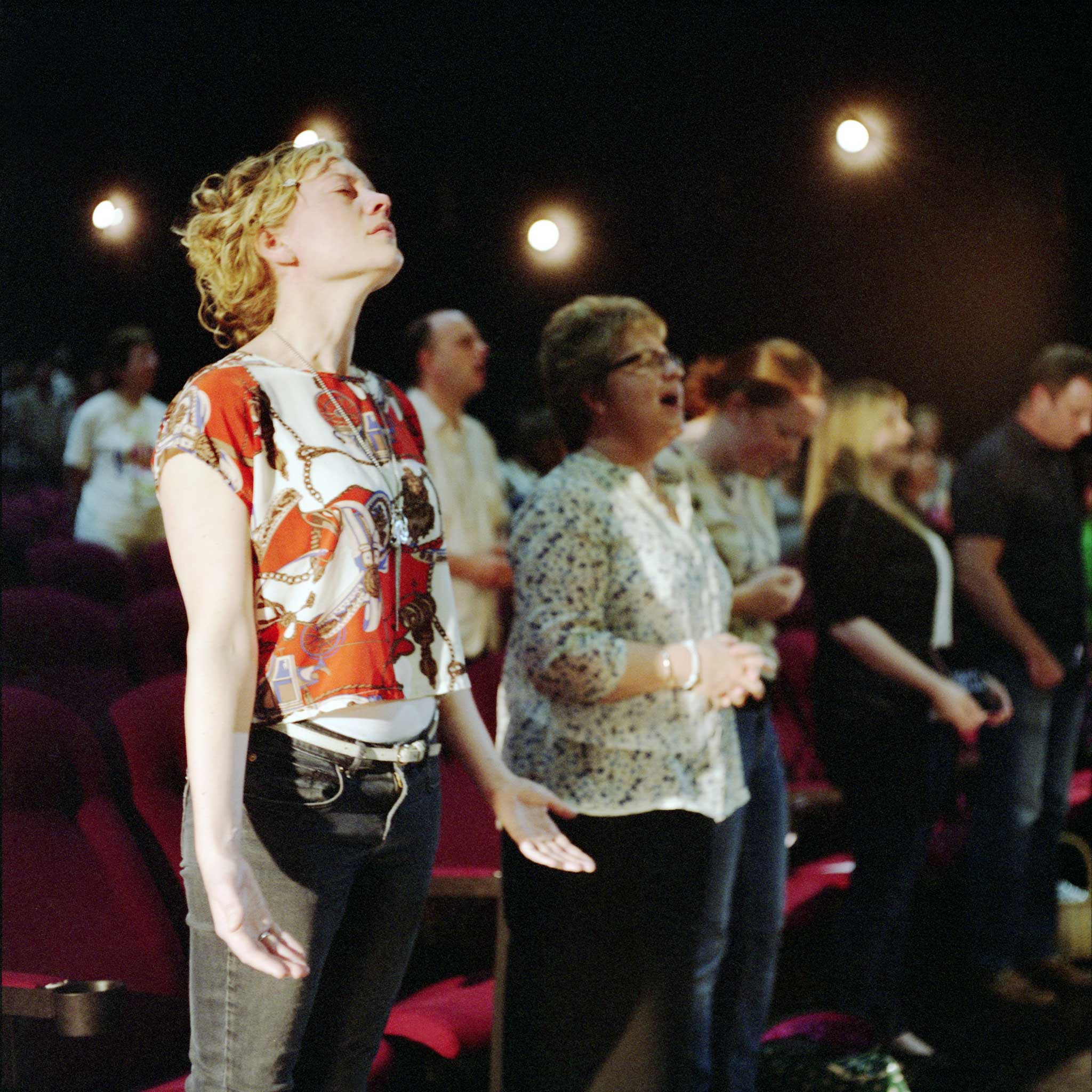 Members of the Ivy Church worship in a Manchester cinema