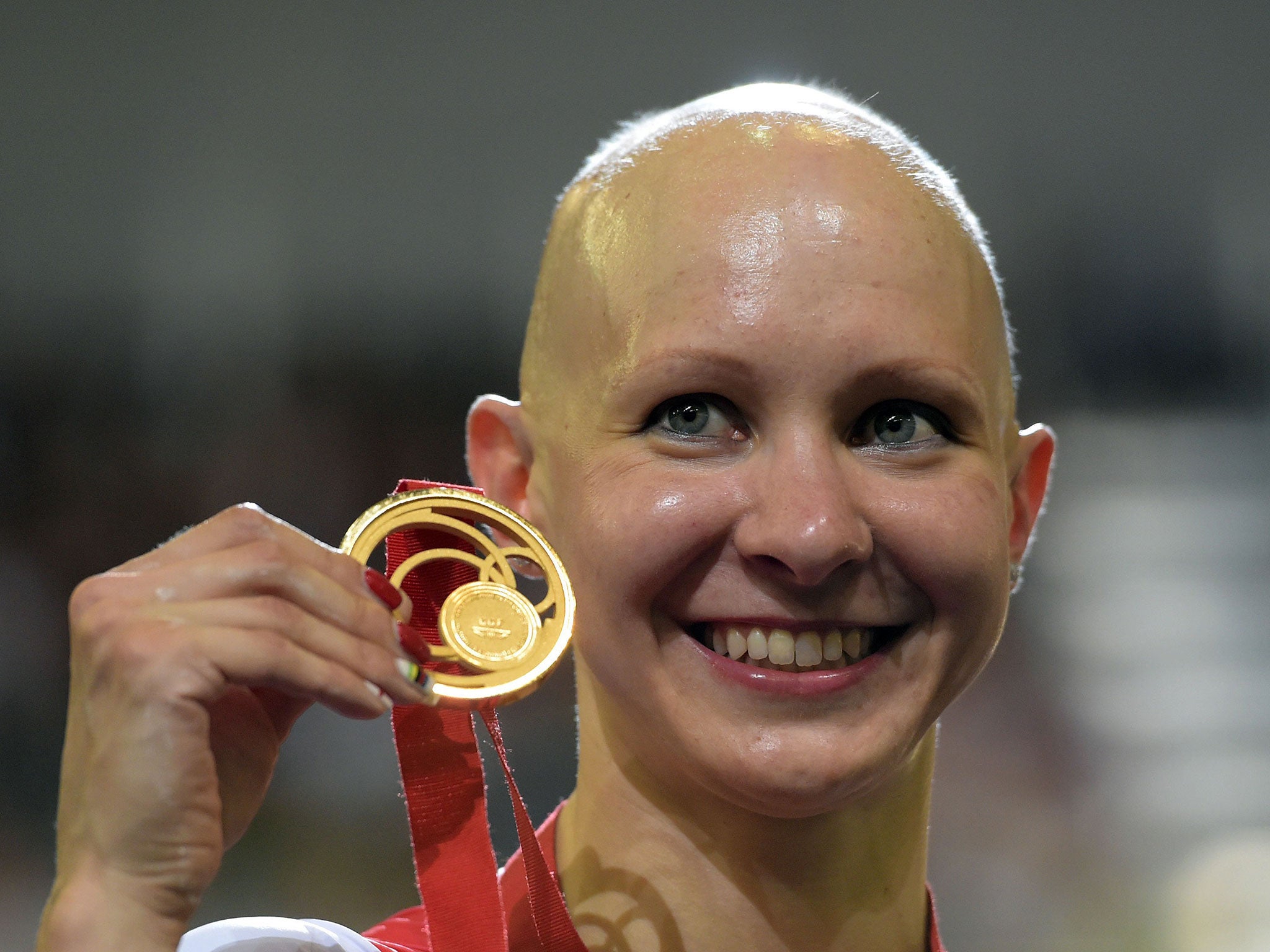 England's Joanna Rowsell celebrates with her gold medal after winning the Women's 3000m Individual Pursuit Final at the Sir Chris Hoy Velodrome