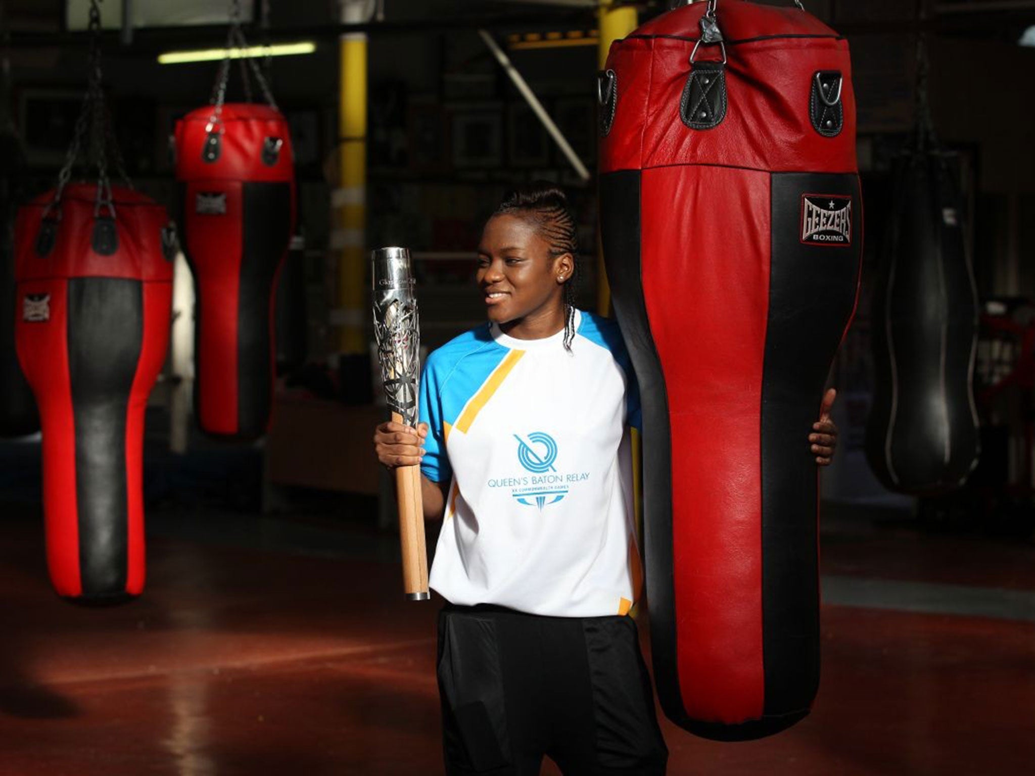 Golden girls: Nicola Adams with the Queen’s baton