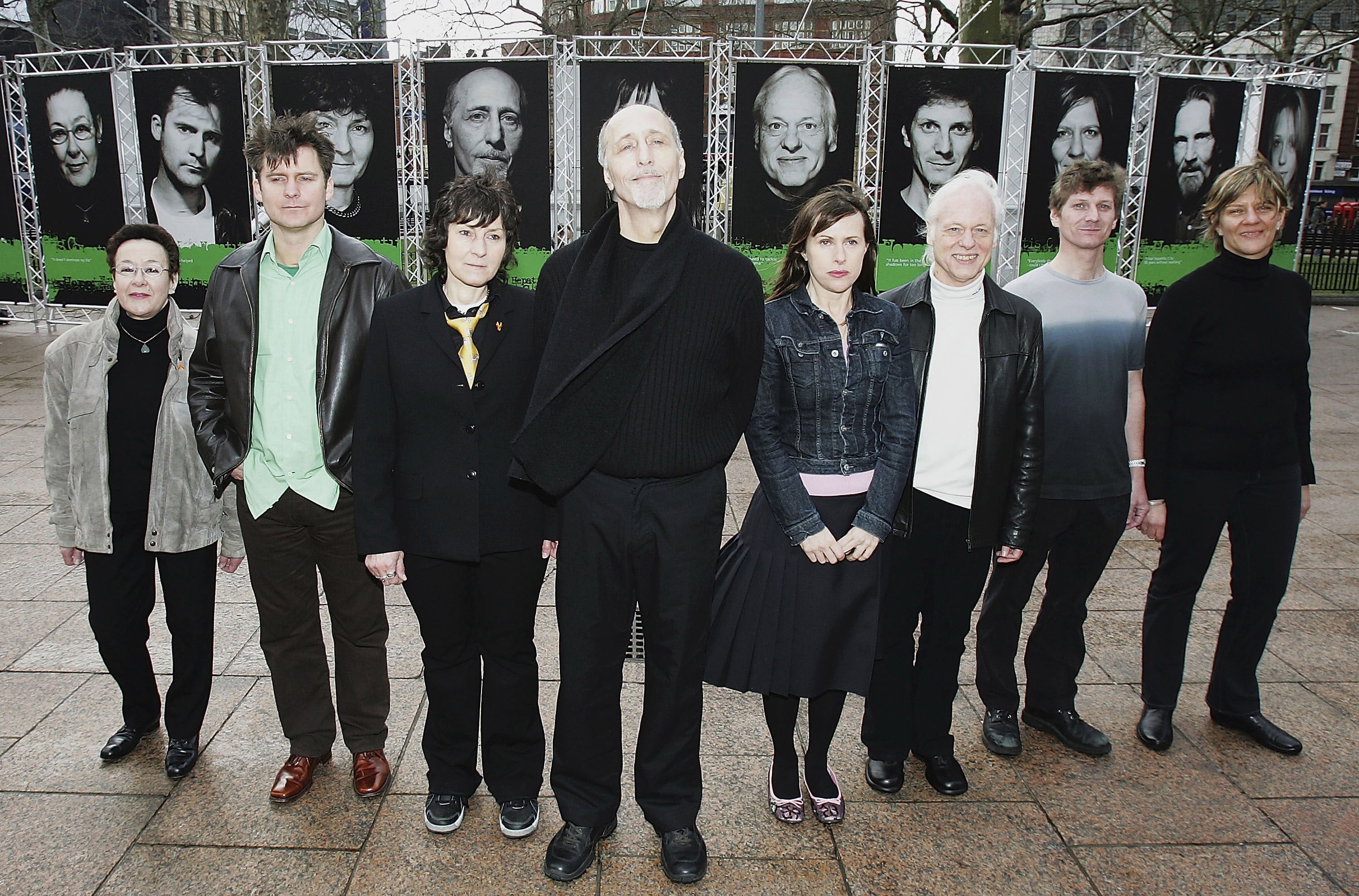 Former Beach Boy David Marks, who suffered from hepatitis C, and photographer Michelle Martinoli pose with others who feature in the exhibition of people who have lived with the illness, March 2005