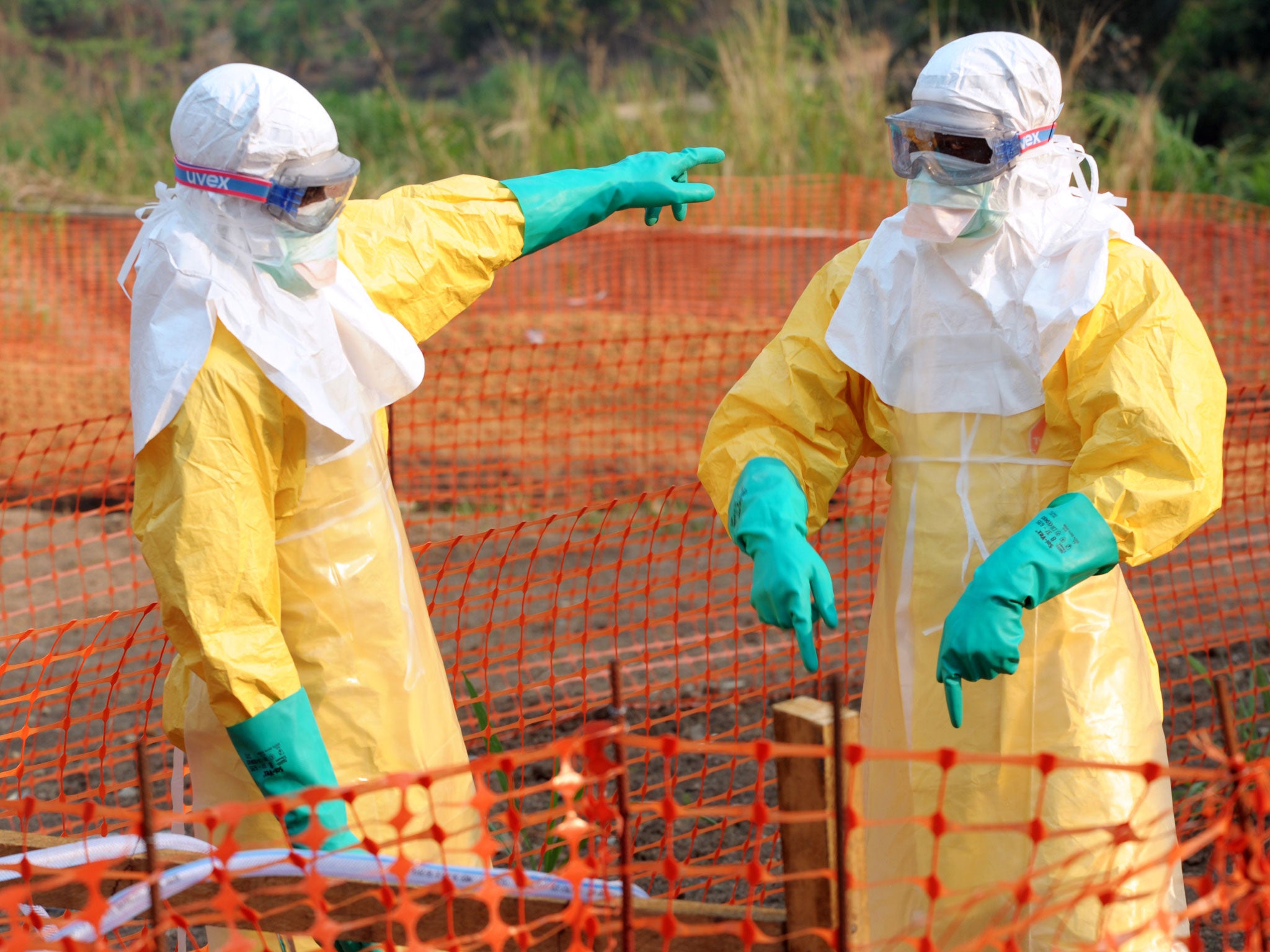 Doctors in protective gear work inside the Medecins Sans Frontieres isolation ward as Guinea faced the worst ever outbreak of the Ebola virus