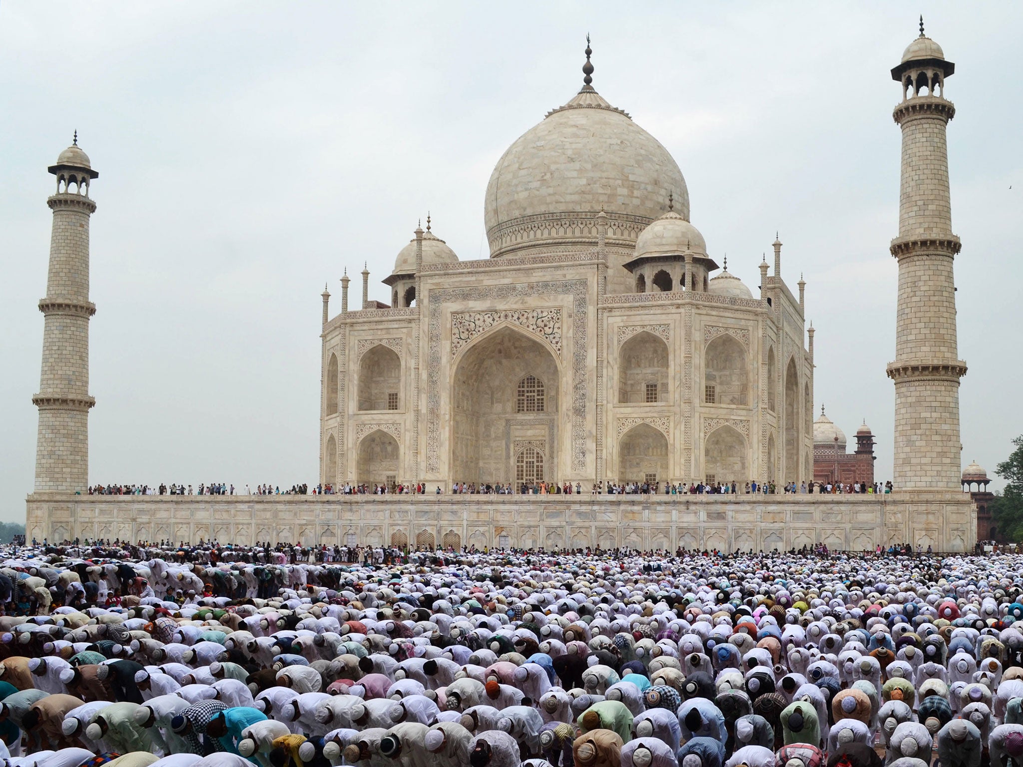 Indian Muslim devotees offer Eid al-Fitr prayers at the historic Taj Mahal in Agra on August 20, 2012