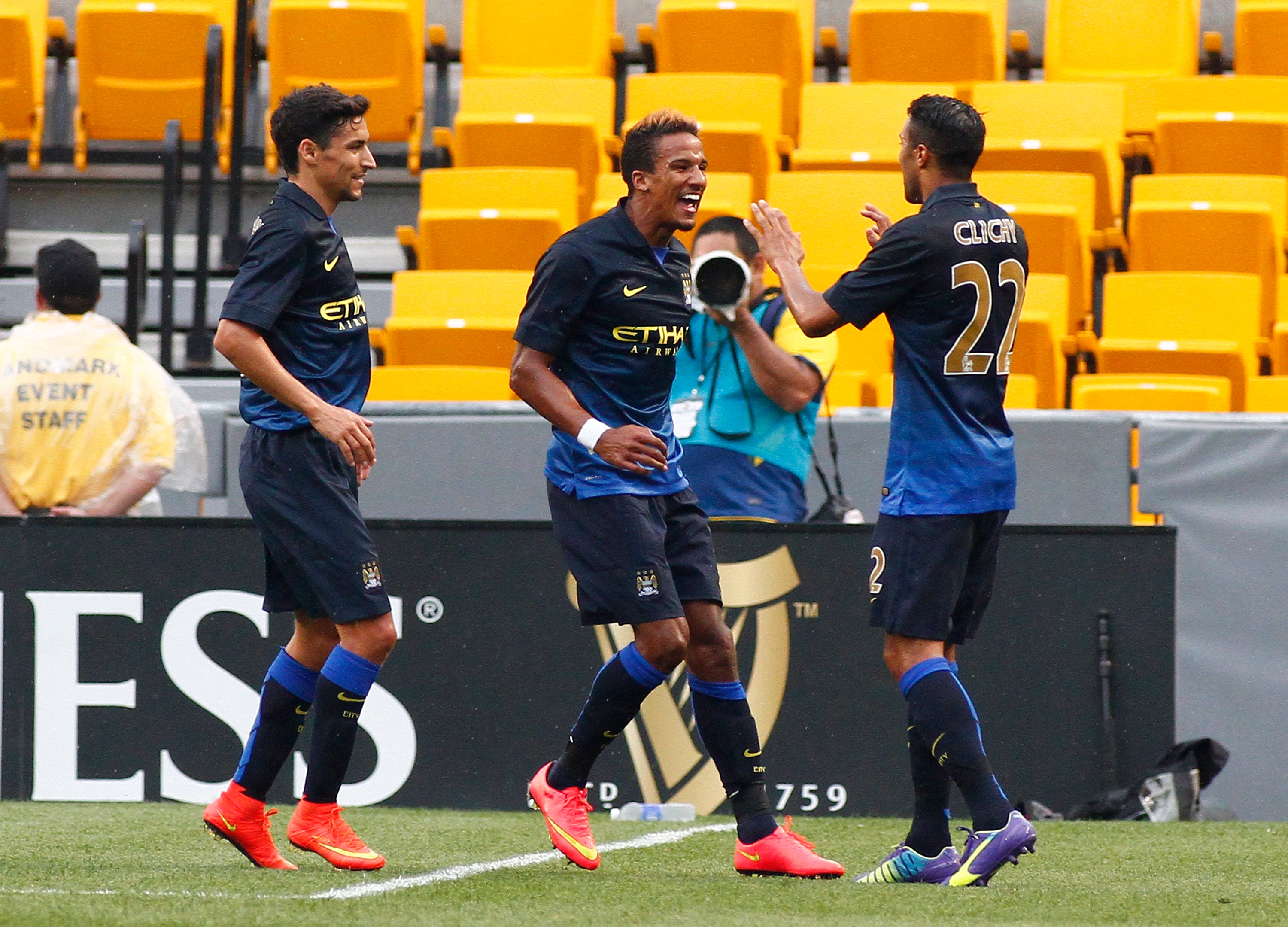 Scott Sinclair, wearing Manchester City's new away shirt, scores against AC Milan