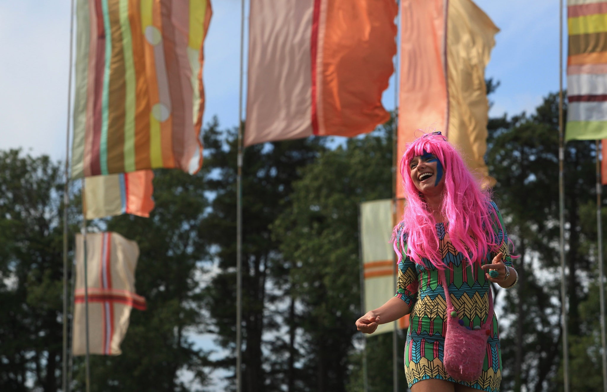 A festival goer enjoys the atmosphere at Womad festival in Wiltshire