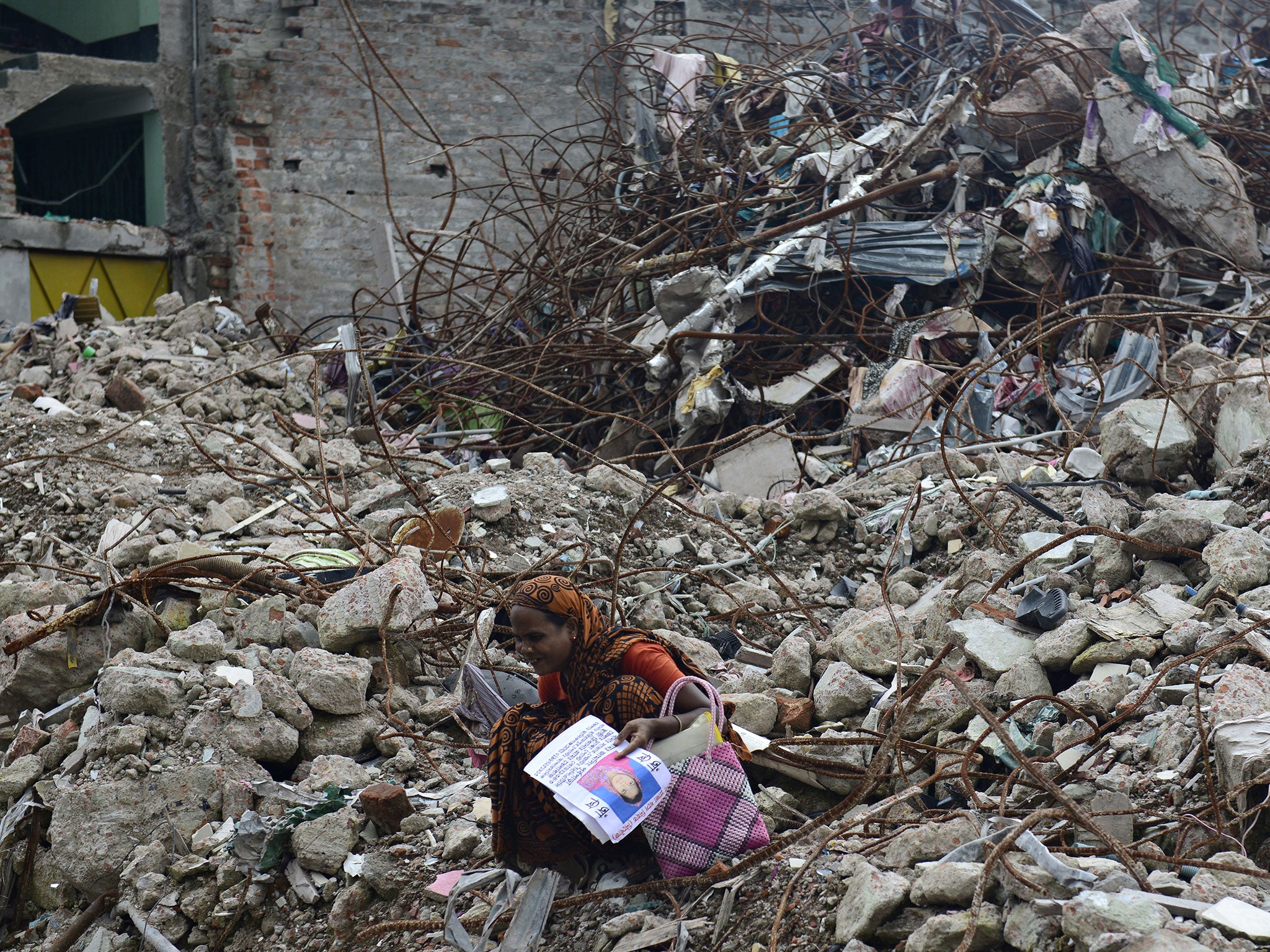 A woman grieves at the scene of the April 24 Rana Plaza garment building in Savar, on the outskirts of Dhaka