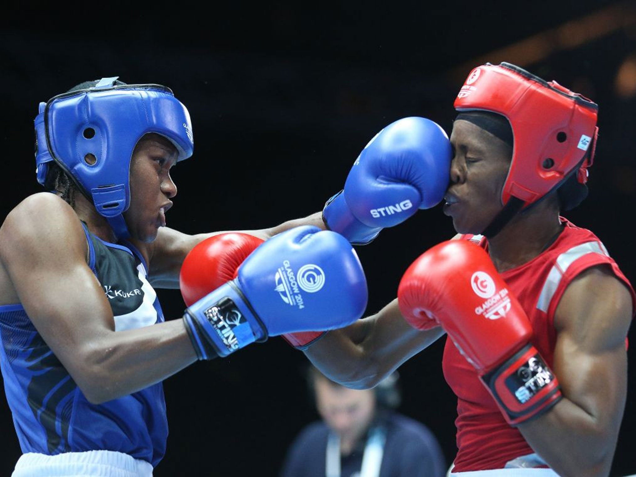 Nicola Adams lands a left jab on Nigeria's Oluwatoyin Oladeji