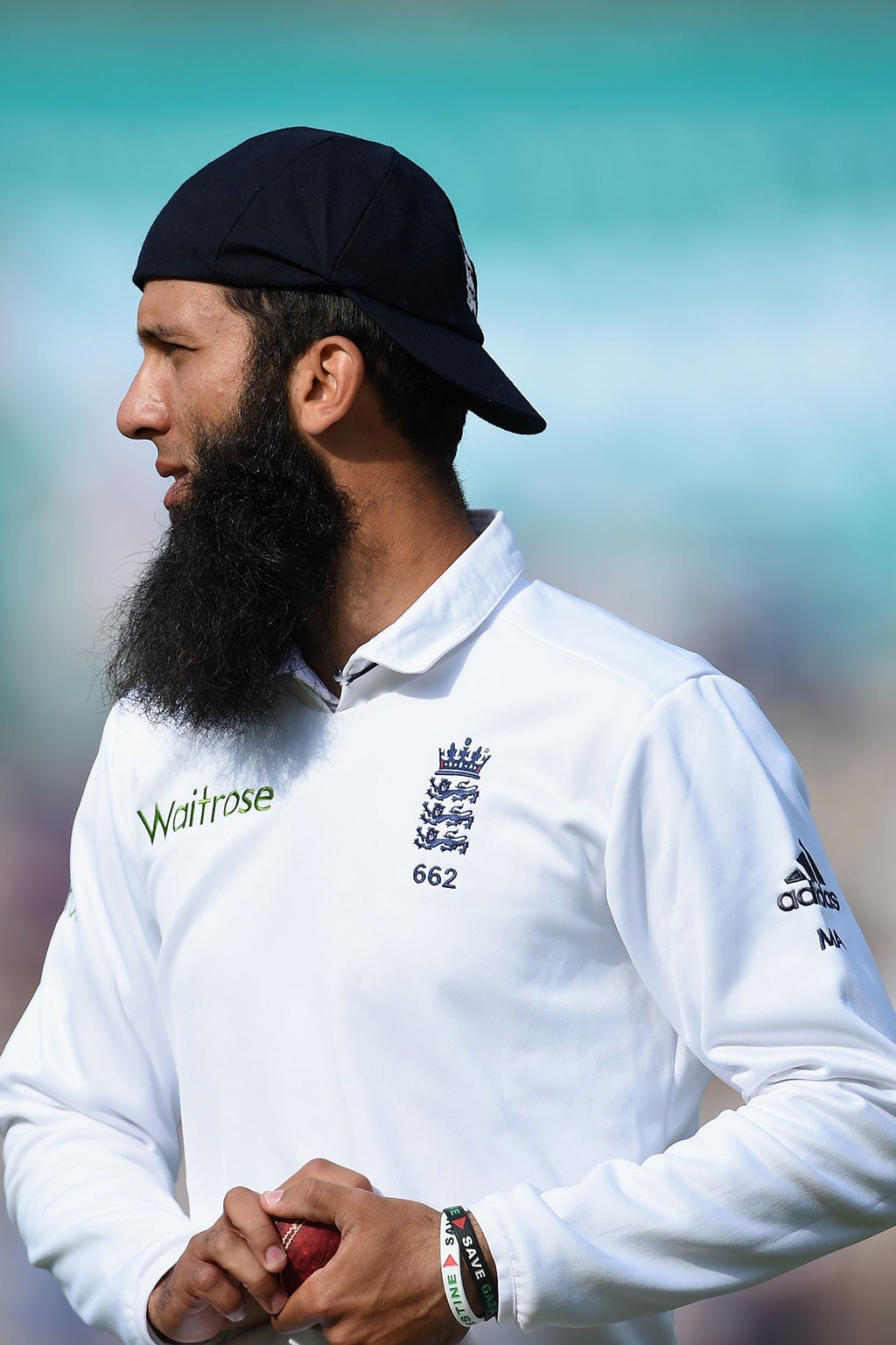 Moeen Ali wearing the 'Save Gaza' and 'Free Palestine' wristbands on his left arm