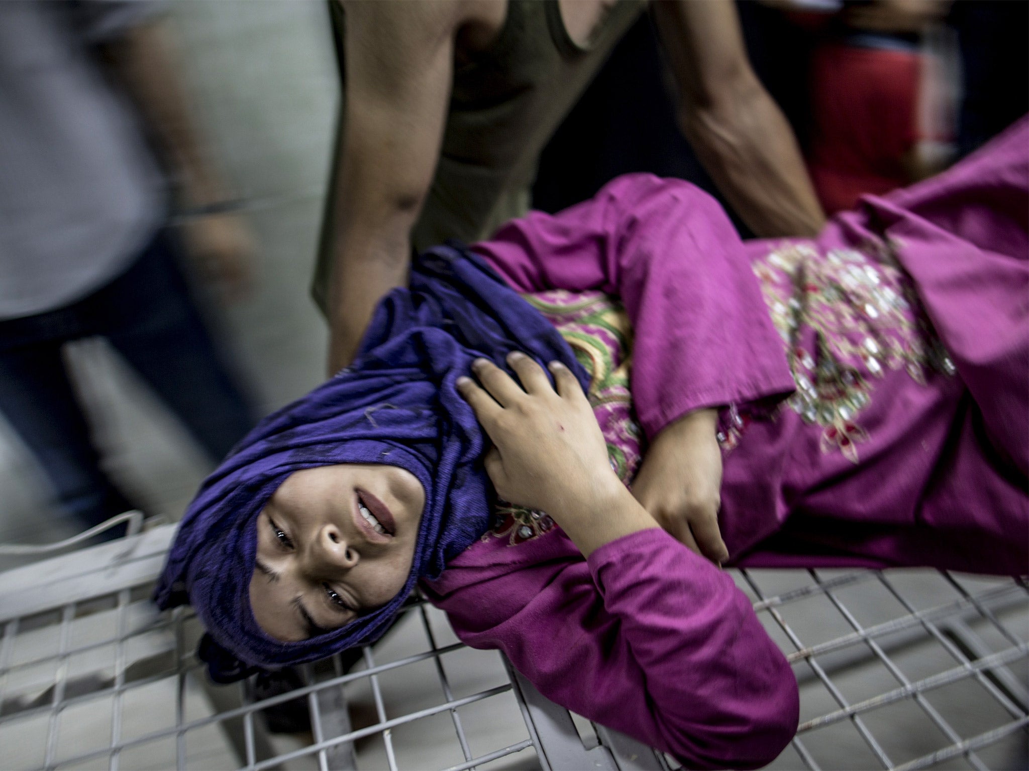 A woman wounded in an Israeli strike is taken to hospital in Beit Lahia, Gaza (Getty)