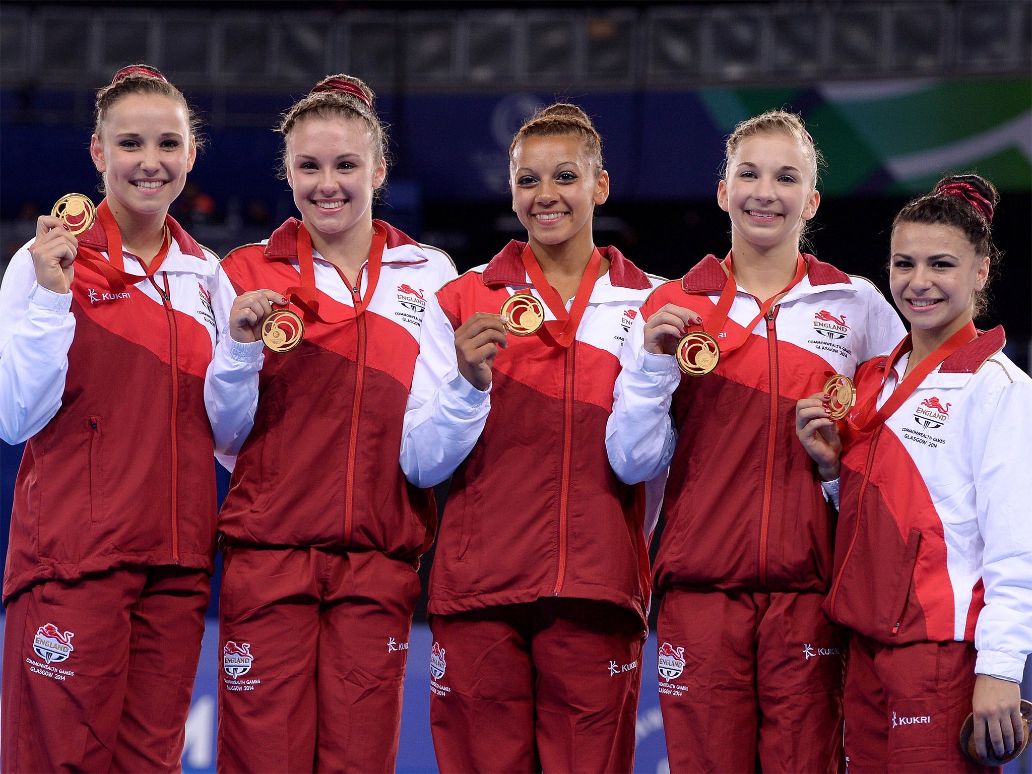 The women’s England squad – Hannah Whelan, Ruby Harold, Rebecca Downie, Kelly Simm and Claudia Fragapane – celebrate with their gold medals