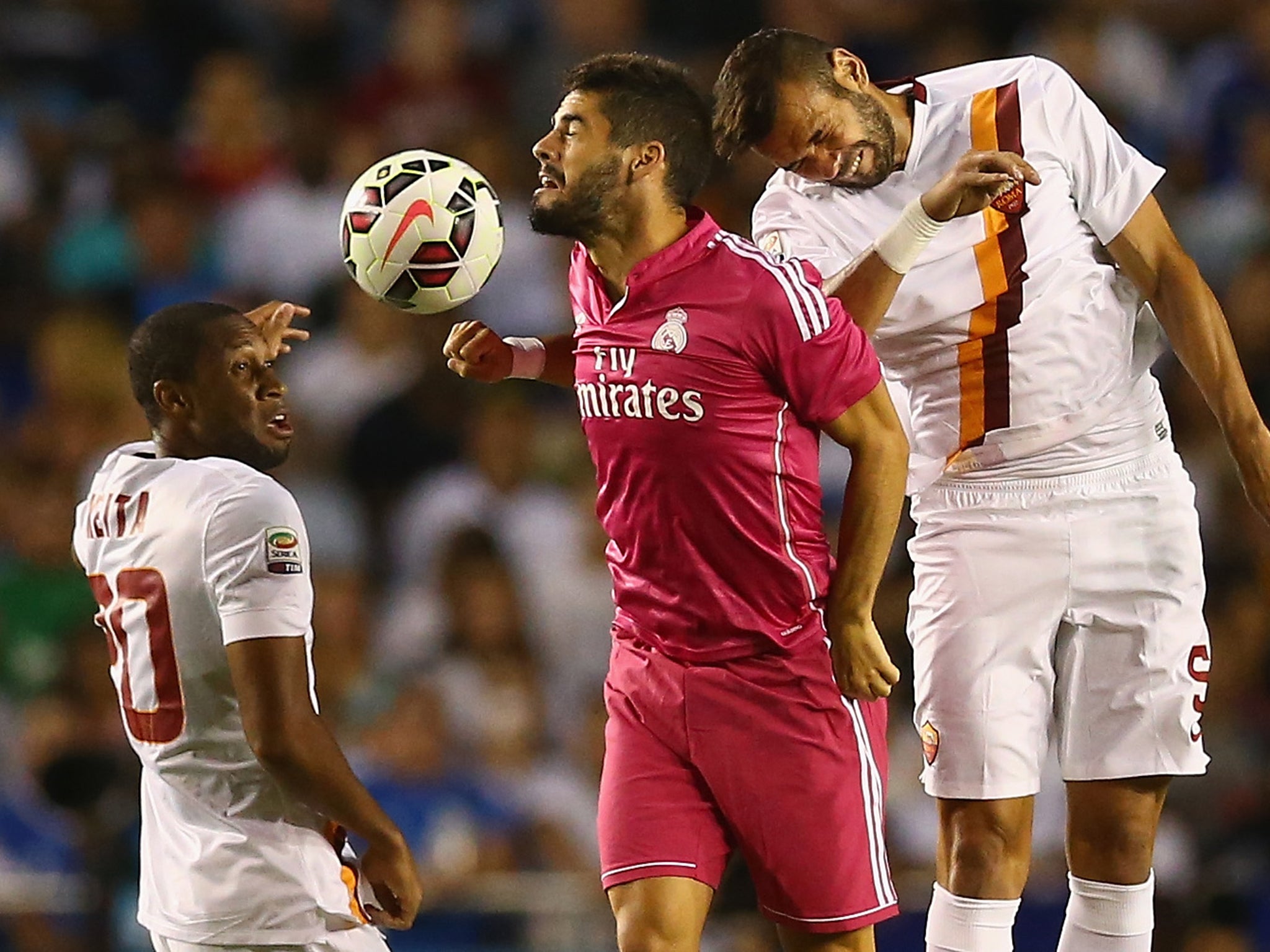 Seydou Keita (left) in action against Real Madrid