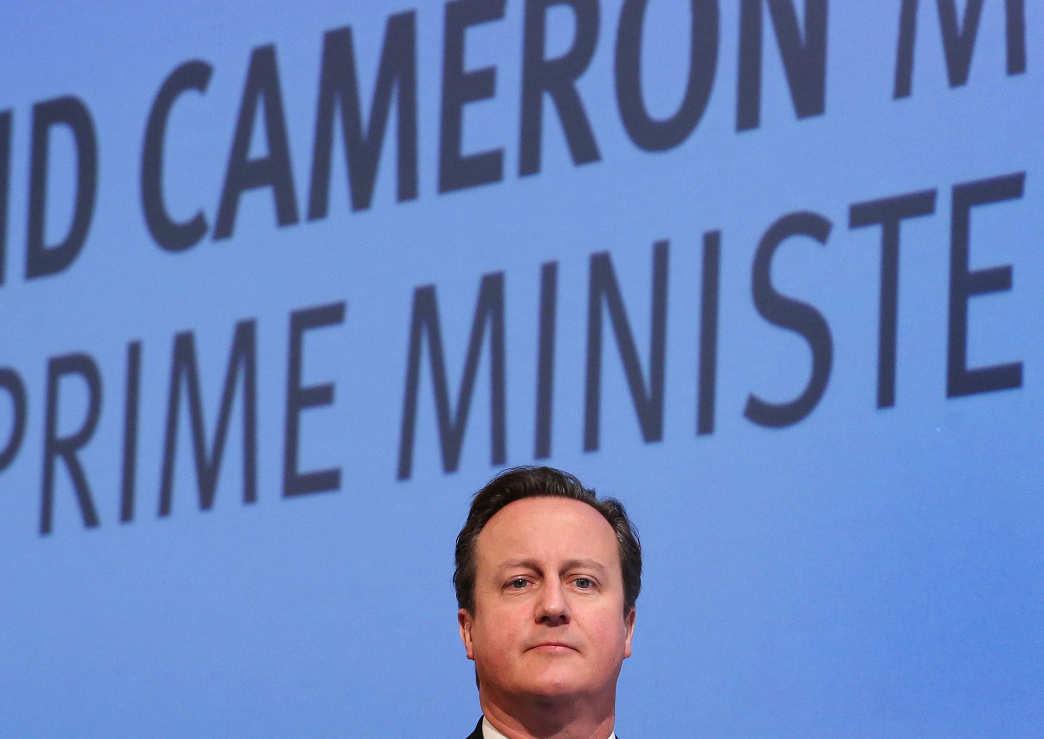 Prime Minister David Cameron walks on stage to speak at The Confederation of British Industry (CBI) annual conference on November 4, 2013