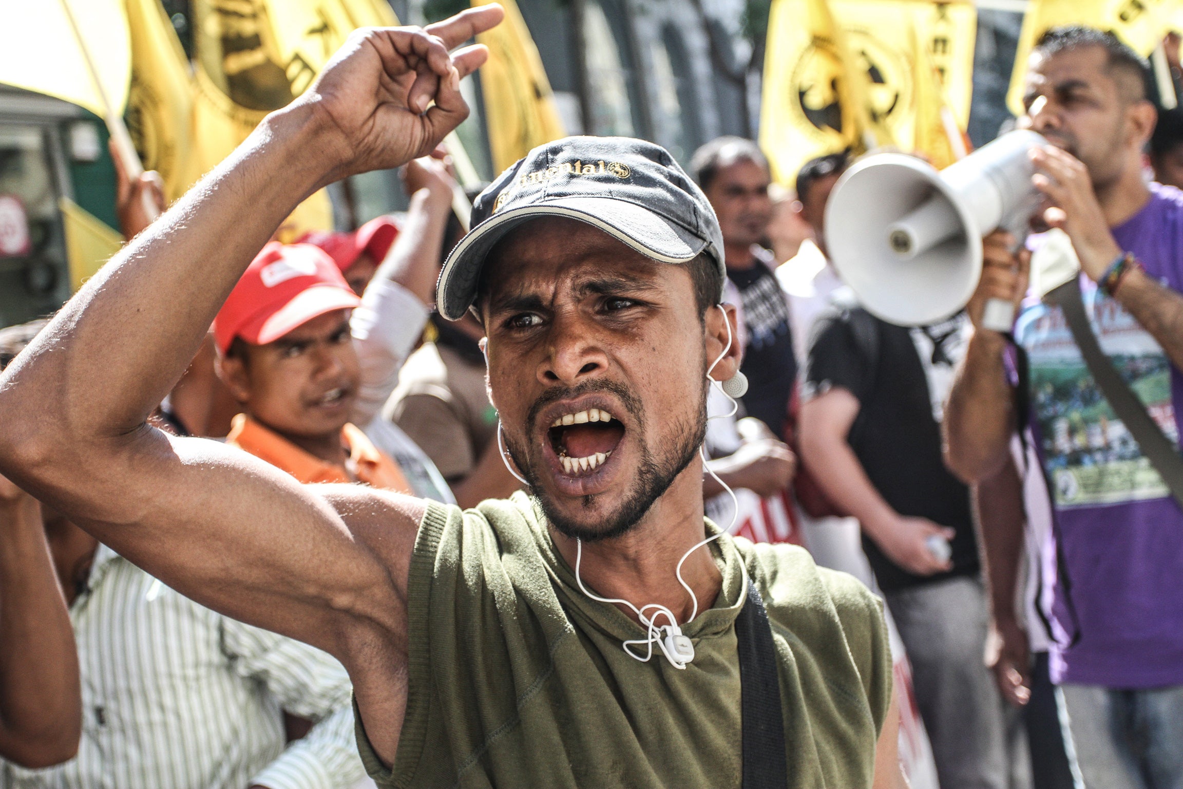 Migrants voice their anger a year after a shooting incident at a strawberry farm in Nea Manolada, Greece. Bangladeshi workers gathered last year to demand payment of wages but around 30 were left injured after being shot