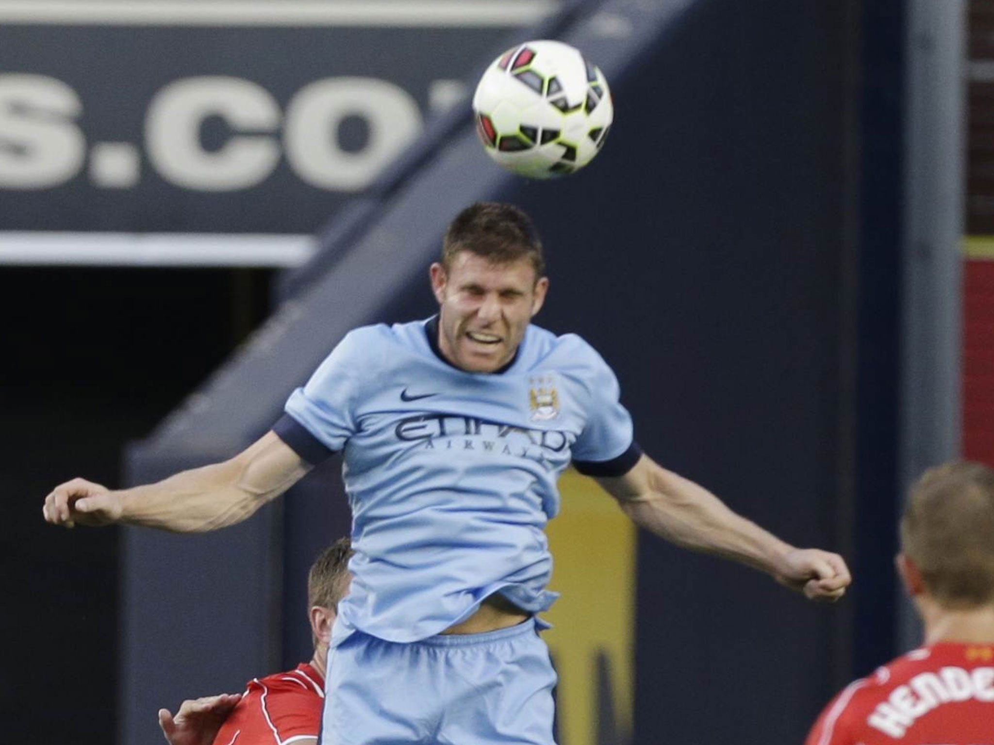 Midfielder James Milner uses his head for Manchester
City in their pre-season match with Liverpool in New York