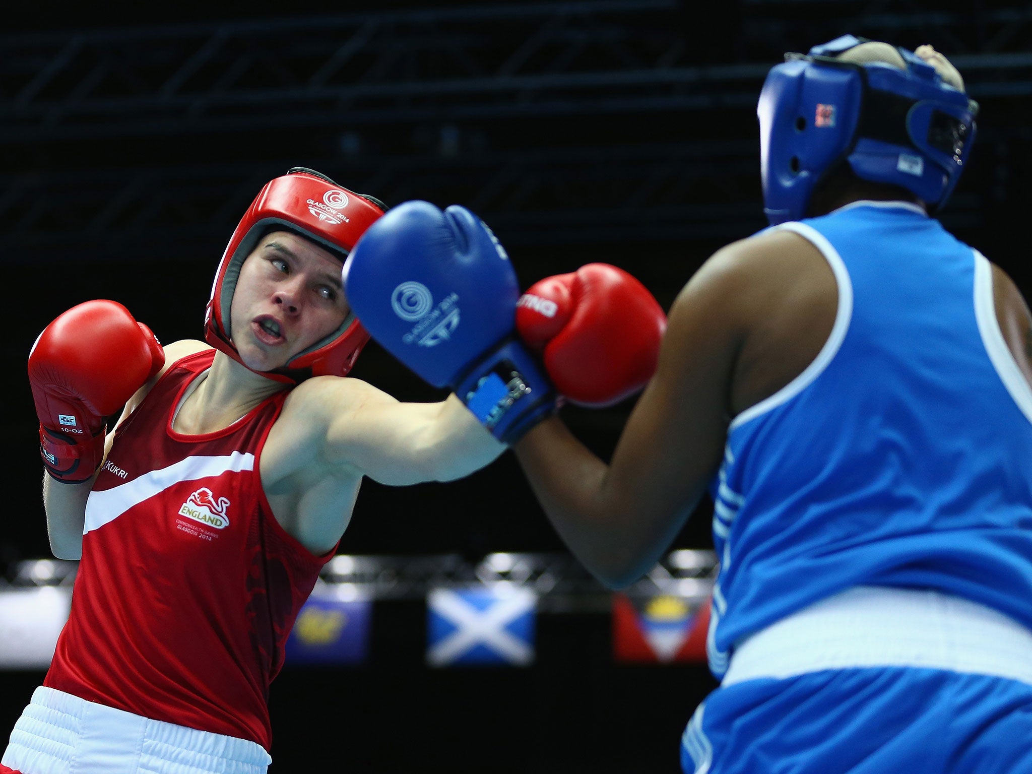 Savannah Marshall (left) beats Pearl Morake to guarantee a bronze medal