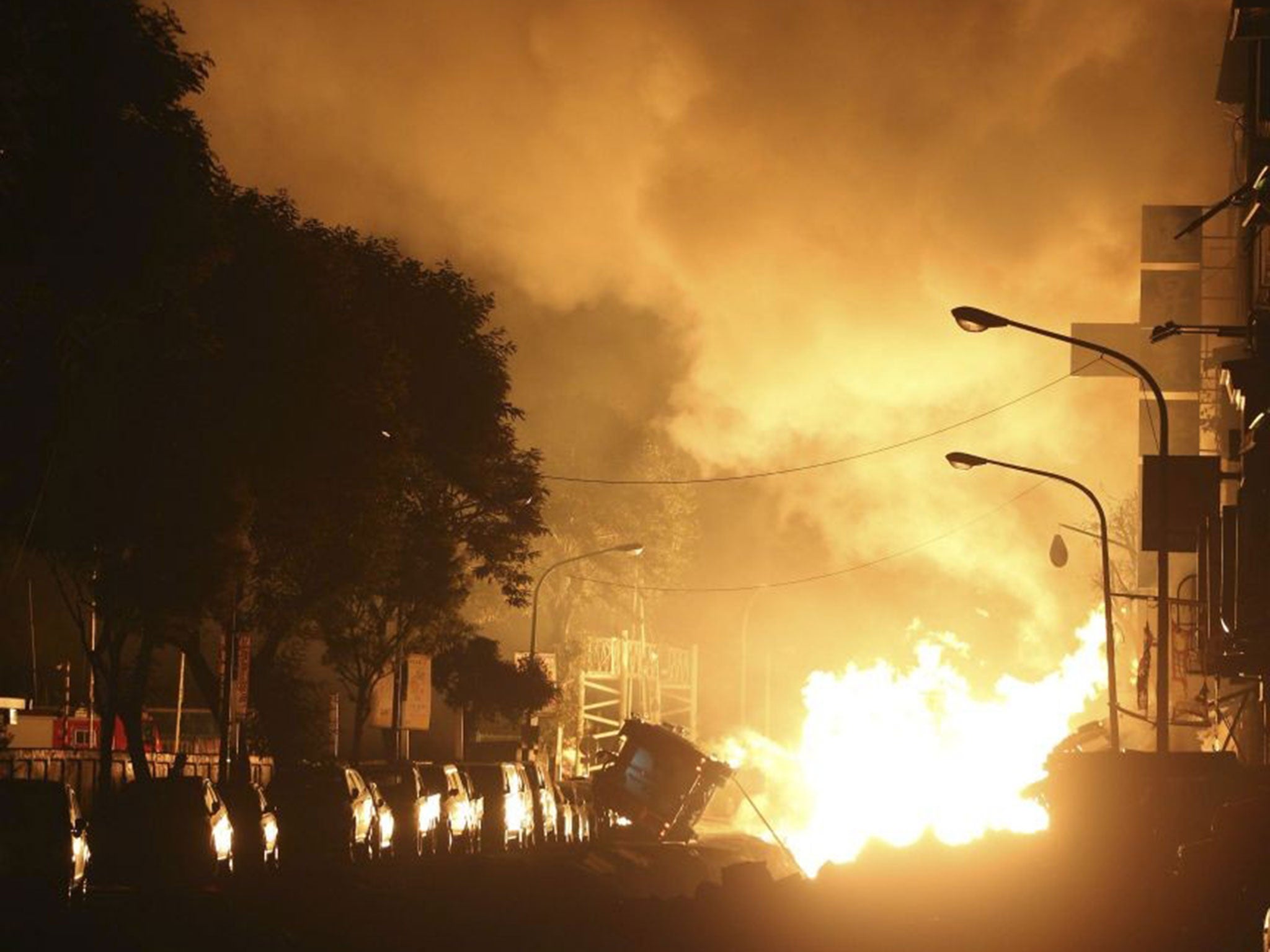 Flames from an explosion from an underground gas leak in the streets of Kaohsiung, Taiwan