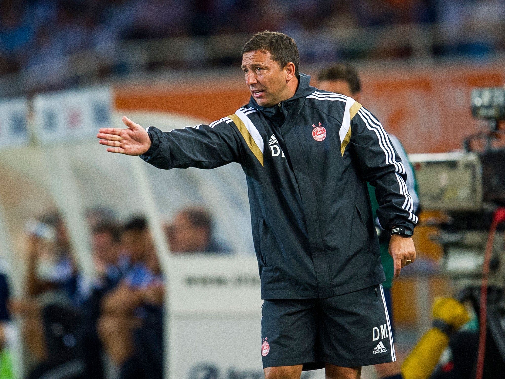 Dereck McInnes gestures from the sidelines during Aberdeen's 2-0 loss to Real Sociedad