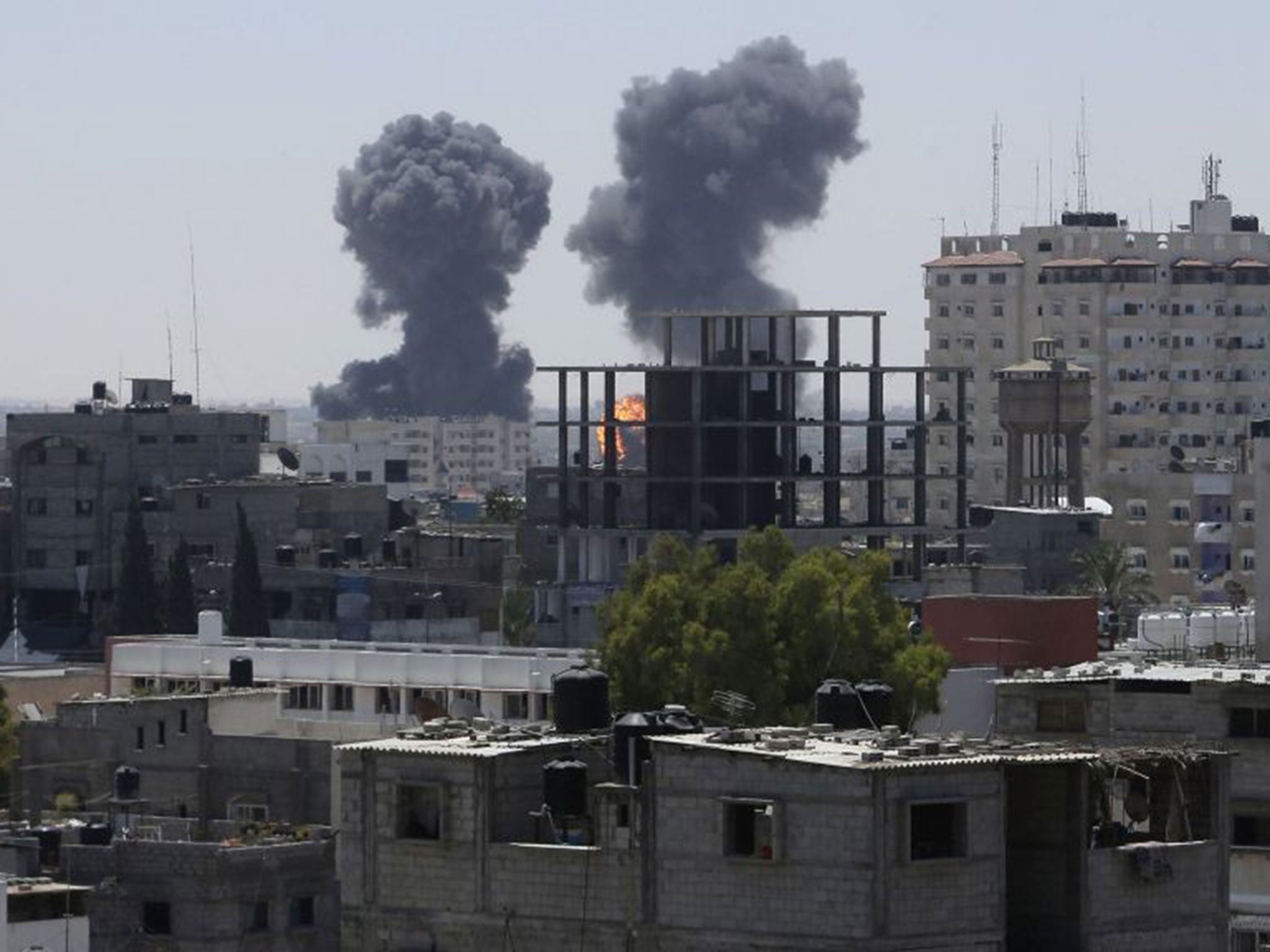 Smoke and flames are seen following what witnesses said were Israeli air strikes in Rafah in the southern Gaza Strip August 1, 2014.